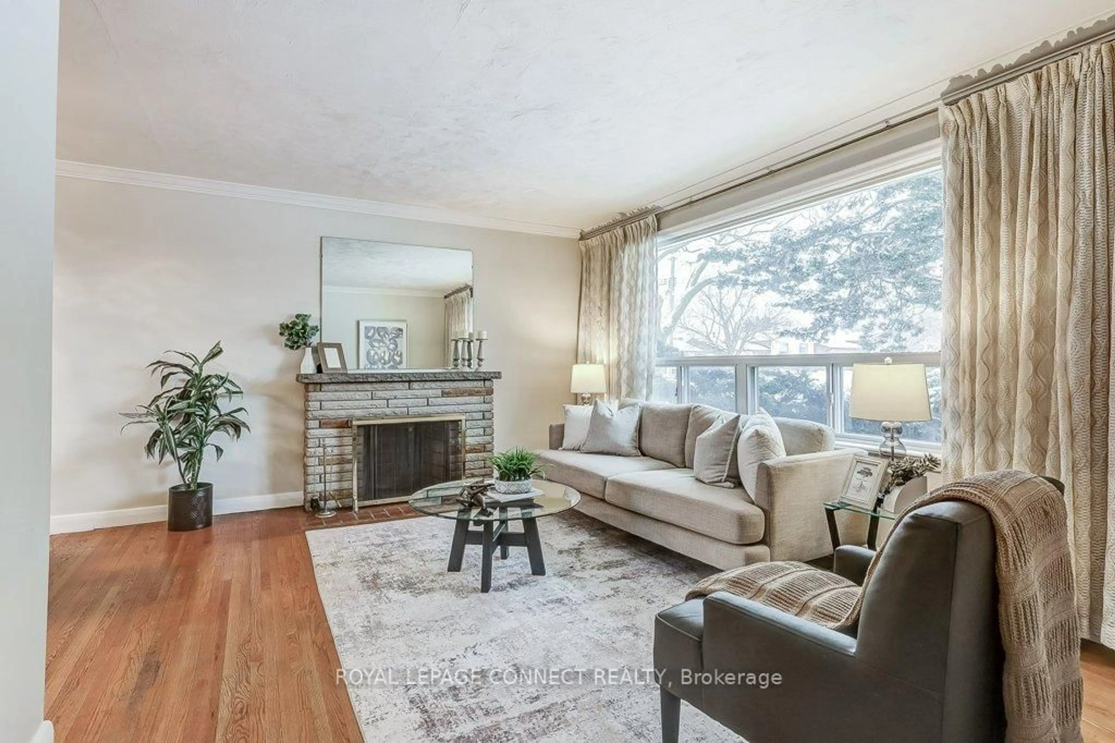 Living room with furniture, wood/laminate floor for 48 Kecala Rd, Toronto Ontario M1P 1K6