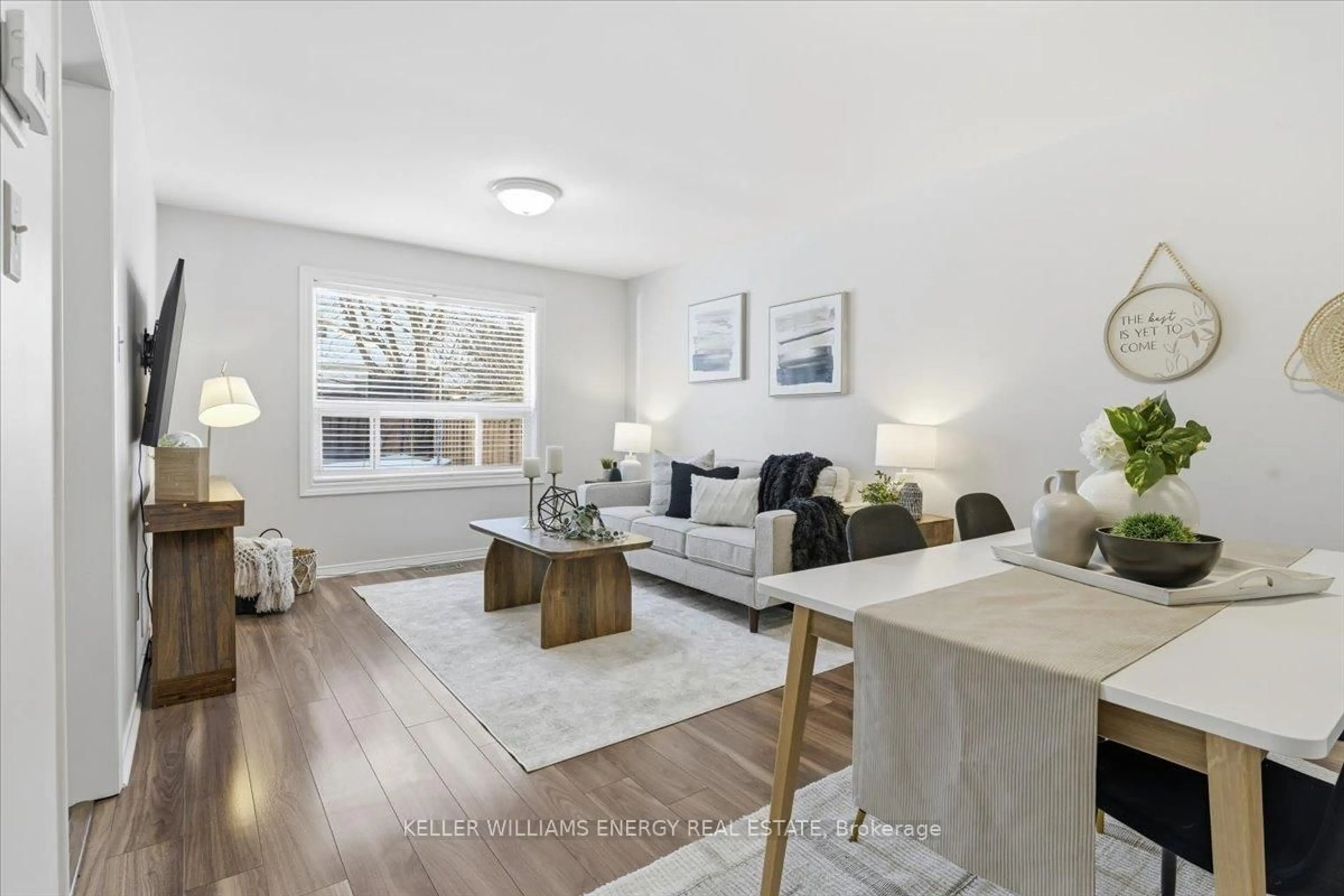 Living room with furniture, wood/laminate floor for 54 Farncomb Cres, Clarington Ontario L1C 4L8