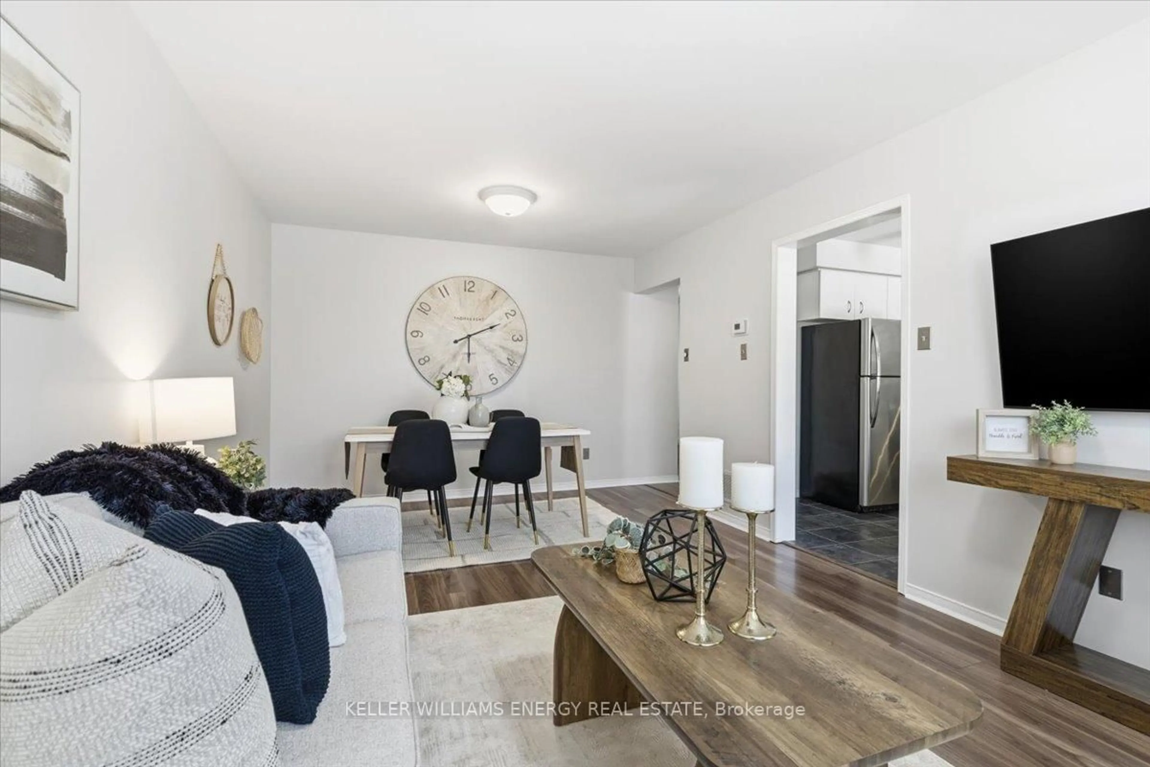 Living room with furniture, wood/laminate floor for 54 Farncomb Cres, Clarington Ontario L1C 4L8
