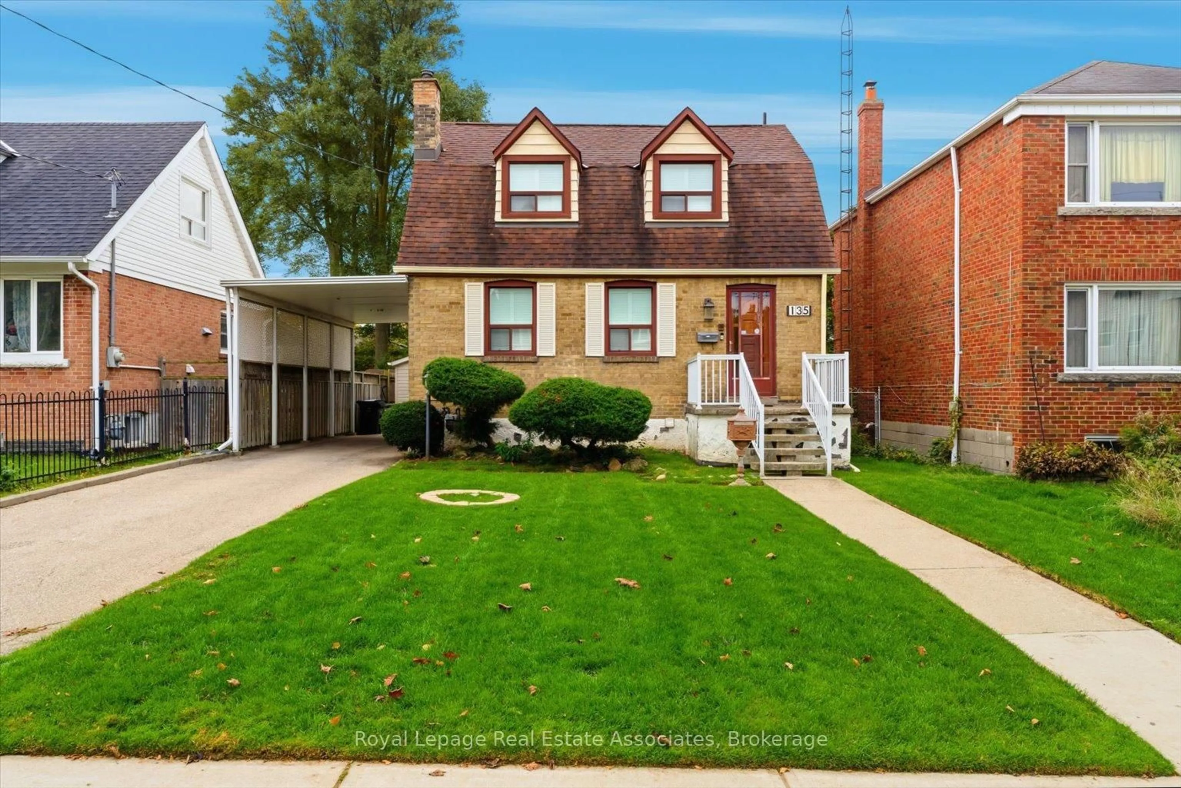 Home with brick exterior material, street for 135 Tiago Ave, Toronto Ontario M4B 2A6