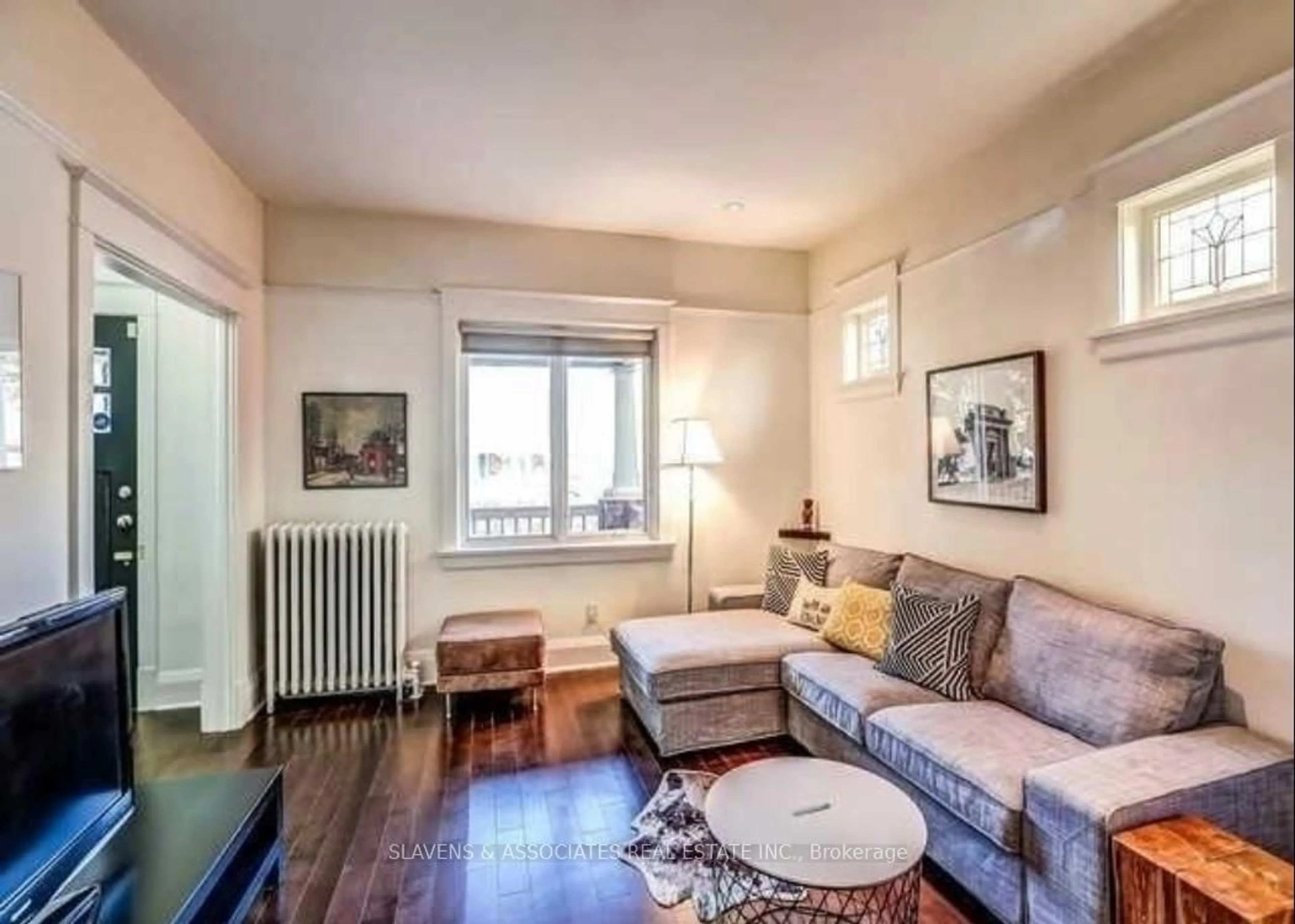 Living room with furniture, wood/laminate floor for 13 Sutherland Ave, Toronto Ontario M4C 1R8