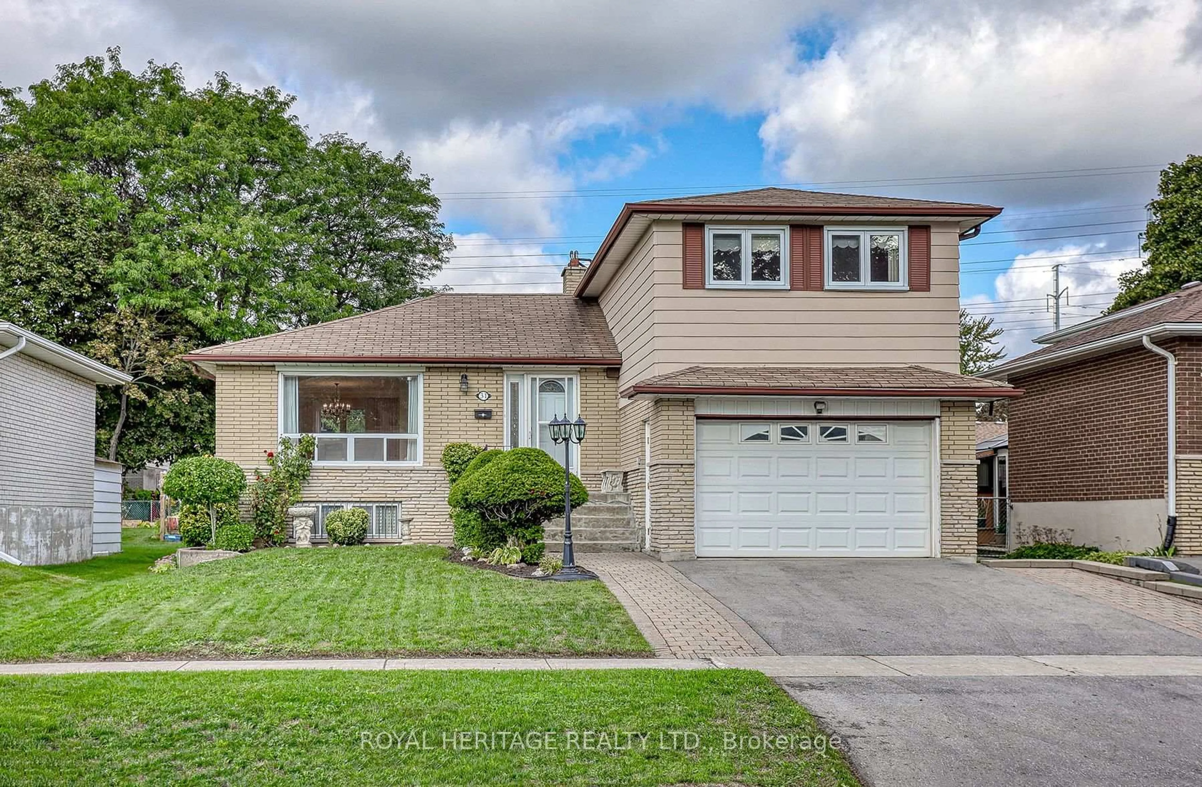 Home with brick exterior material, street for 31 Purpledusk Tr, Toronto Ontario M1E 4C6