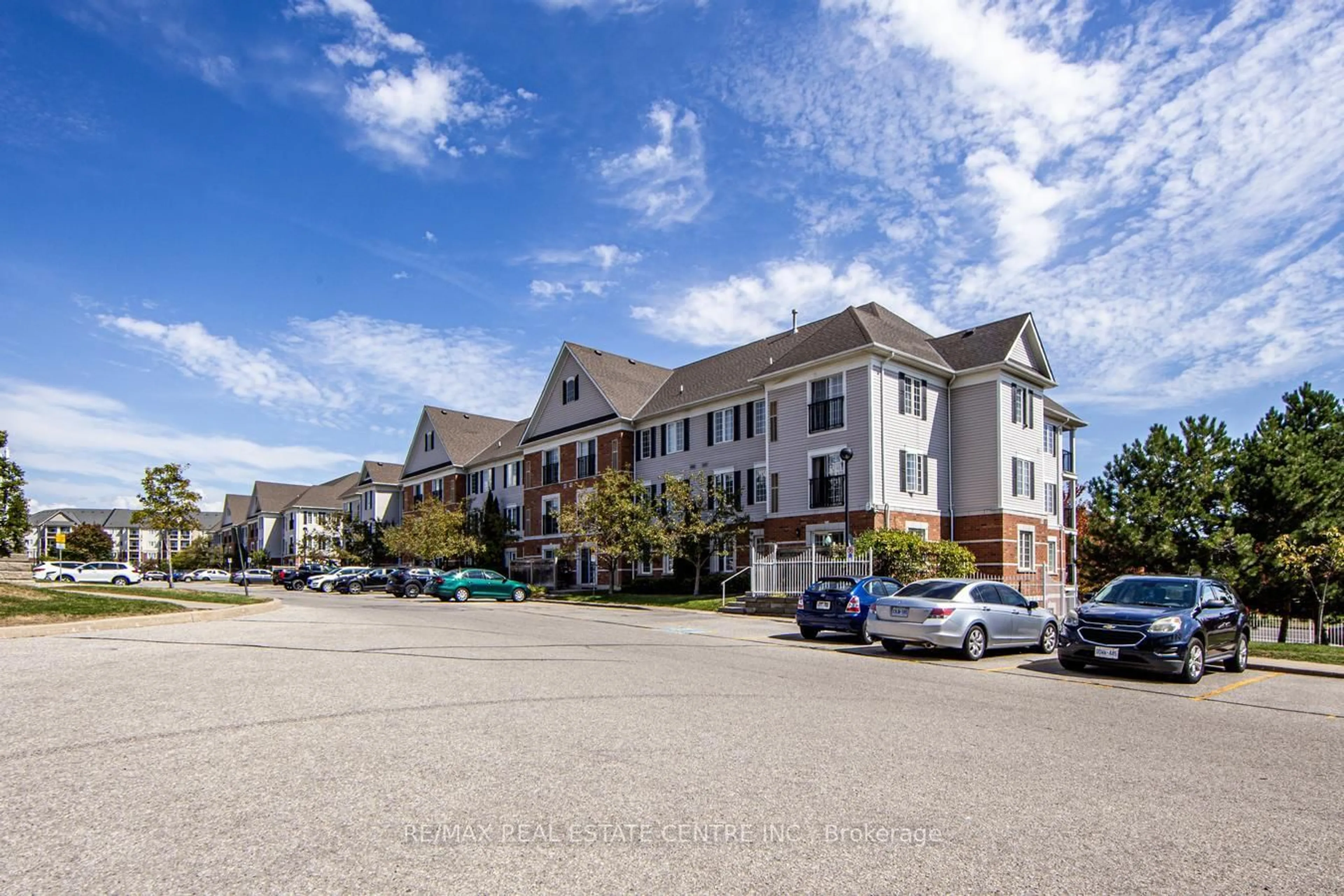 A pic from outside/outdoor area/front of a property/back of a property/a pic from drone, unknown for 106 Aspen Springs Dr #207, Clarington Ontario L1C 5N7