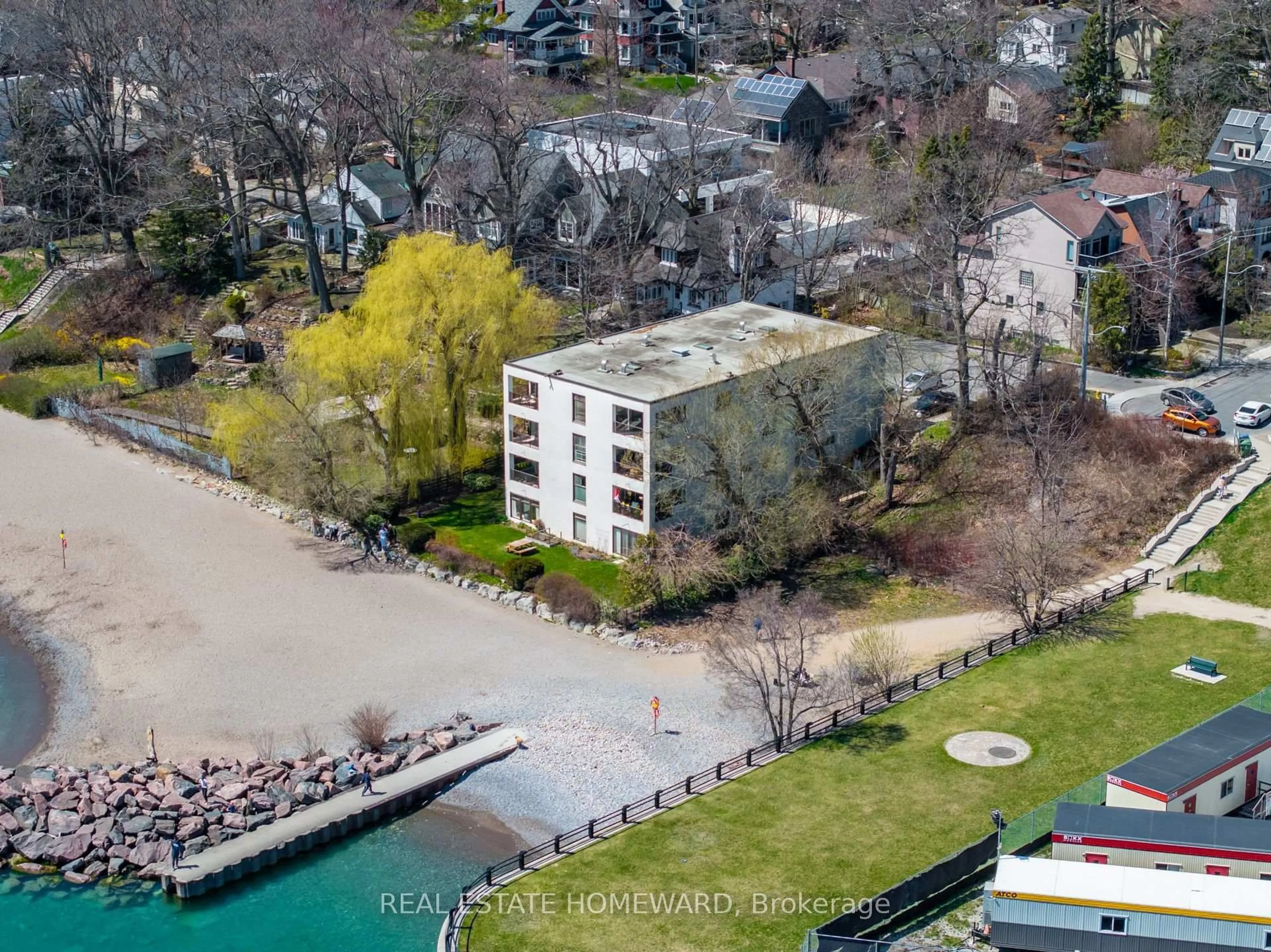 A pic from outside/outdoor area/front of a property/back of a property/a pic from drone, water/lake/river/ocean view for 2 Nursewood Rd #2, Toronto Ontario M4E 3R8