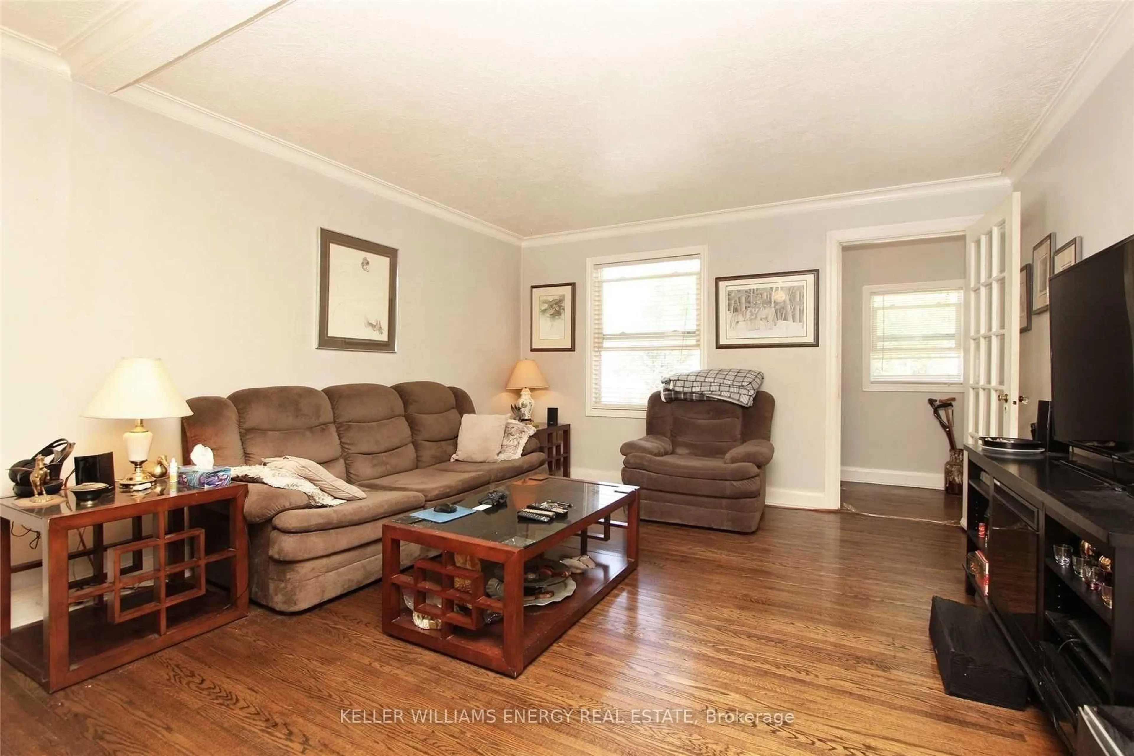 Living room with furniture, wood/laminate floor for 64 Grenfell St, Oshawa Ontario L1J 4W2