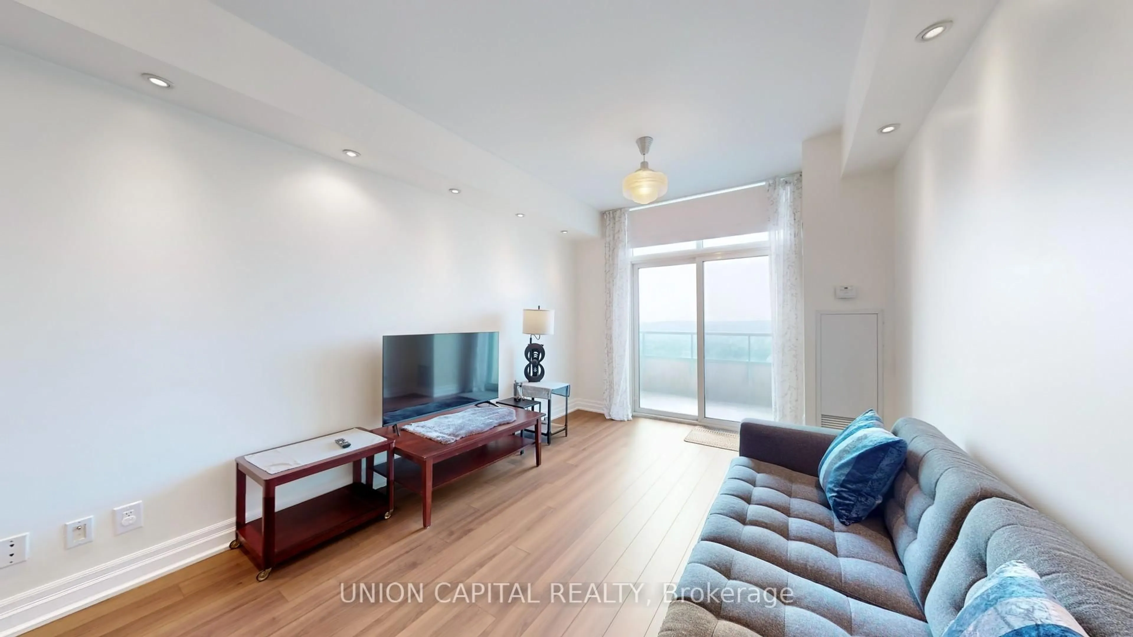 Living room with furniture, wood/laminate floor for 61 Town Centre Crt #PH01, Toronto Ontario M1P 5C5