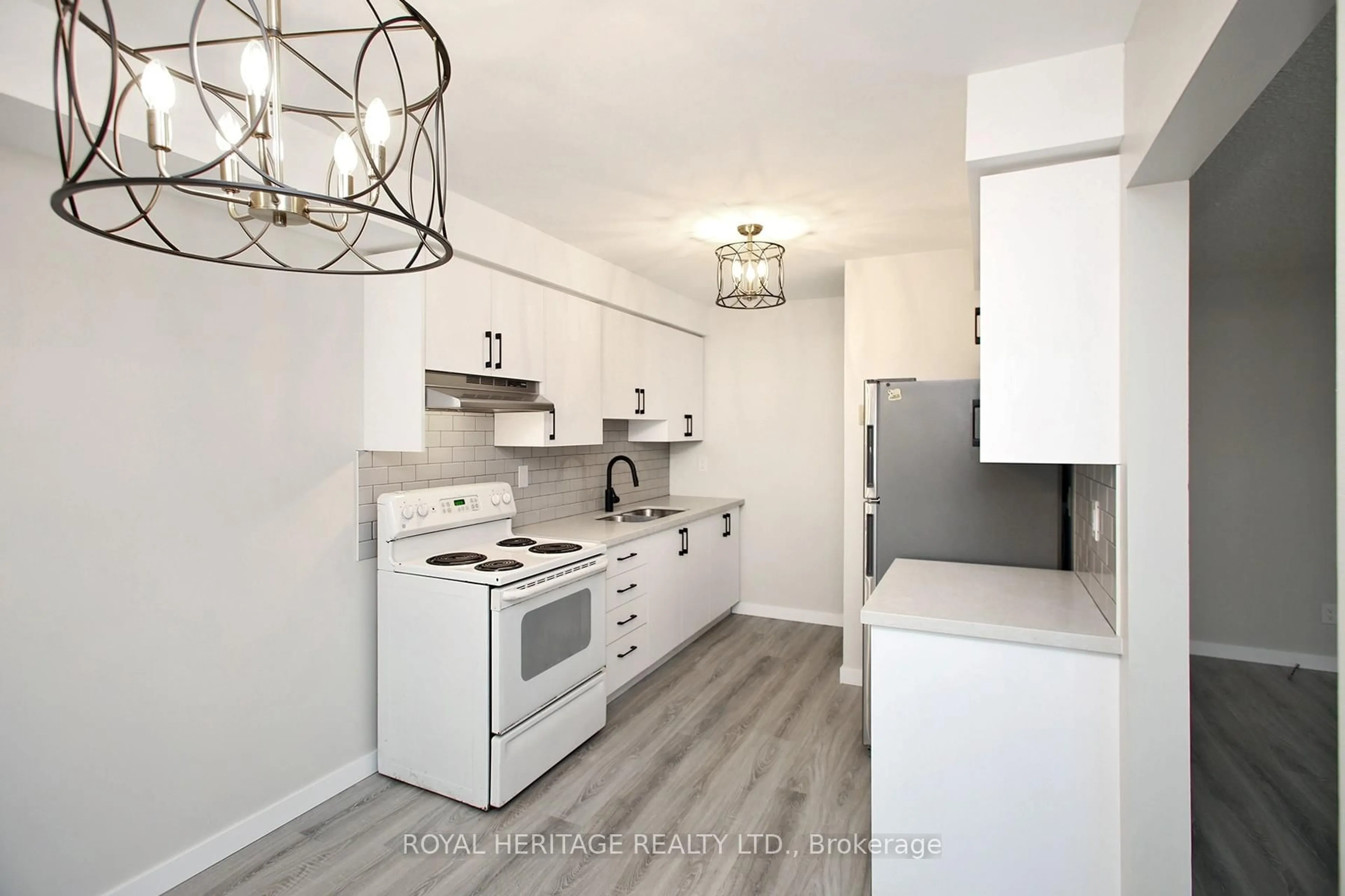 Open concept kitchen, wood/laminate floor for 27 Parker Cres, Ajax Ontario L1S 3R4