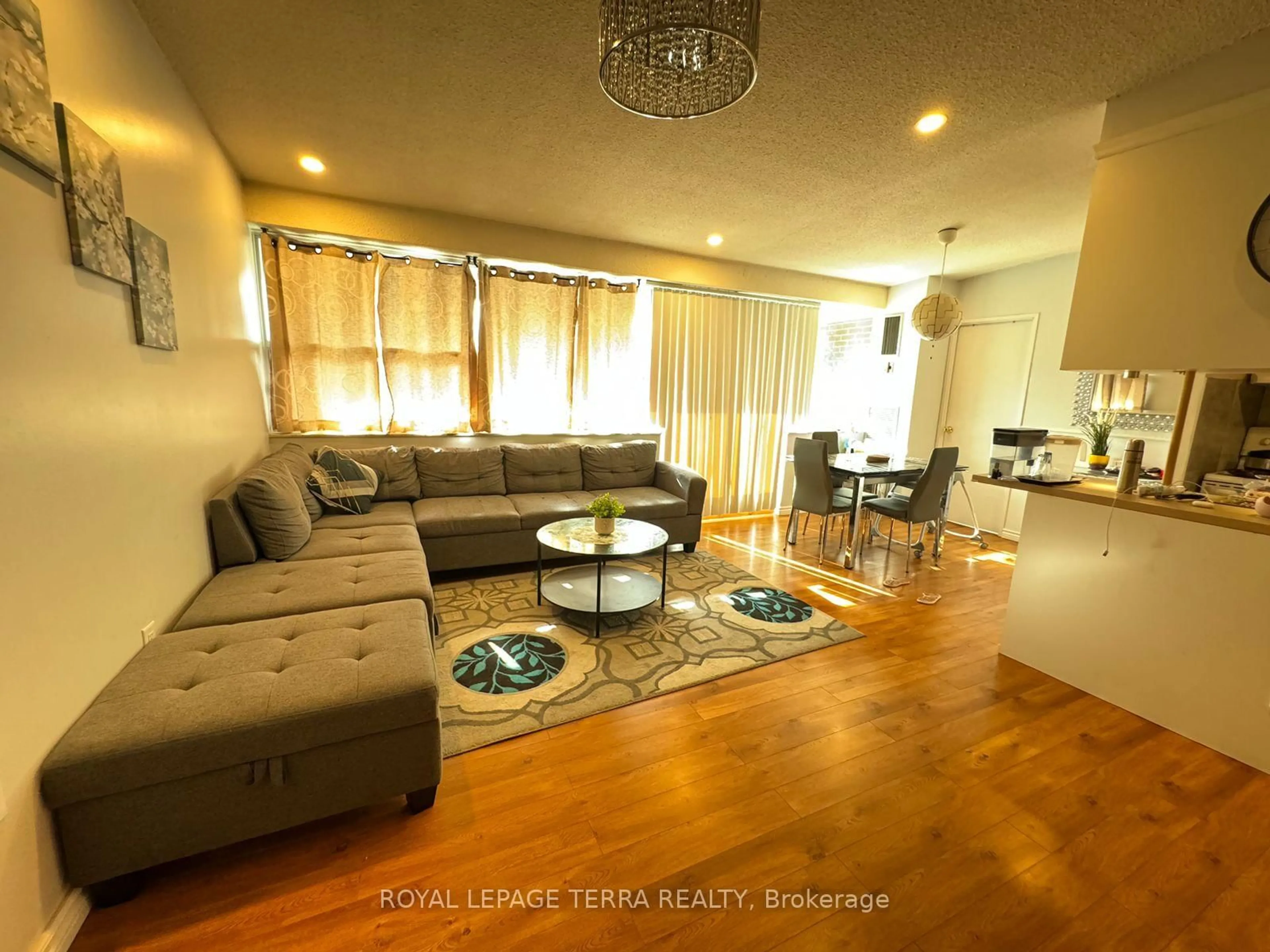 Living room with furniture, wood/laminate floor for 4064 Lawrence Ave #602, Toronto Ontario M1E 4V6