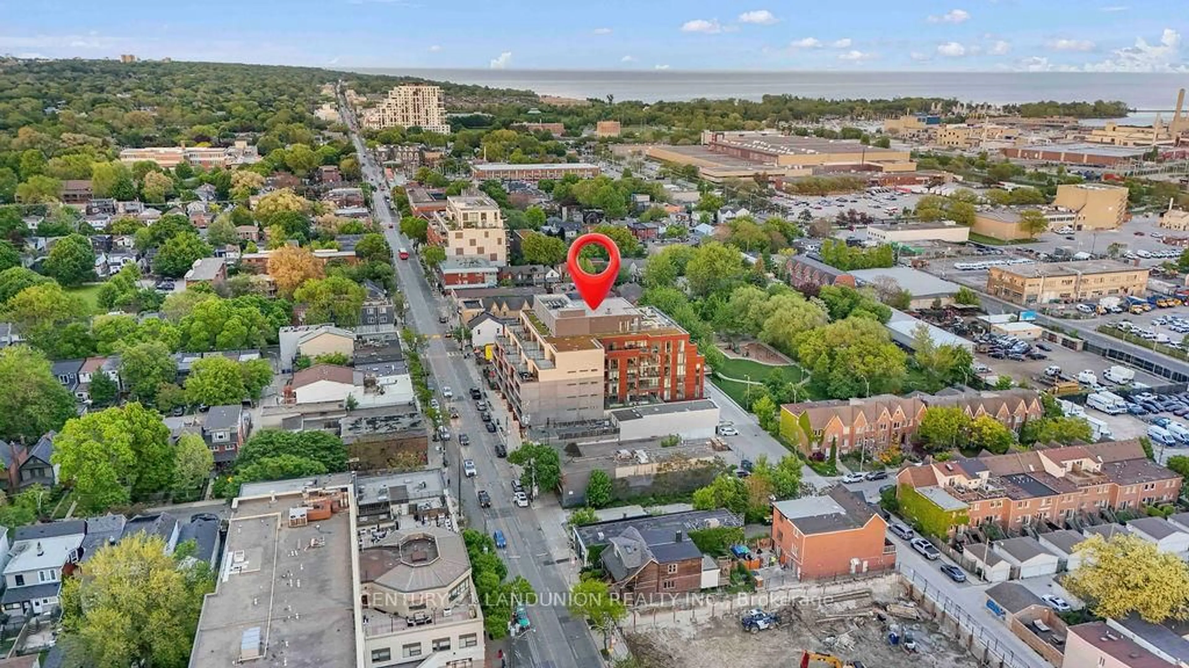 A pic from outside/outdoor area/front of a property/back of a property/a pic from drone, city buildings view from balcony for 1285 Queen St #102, Toronto Ontario M4L 1C2