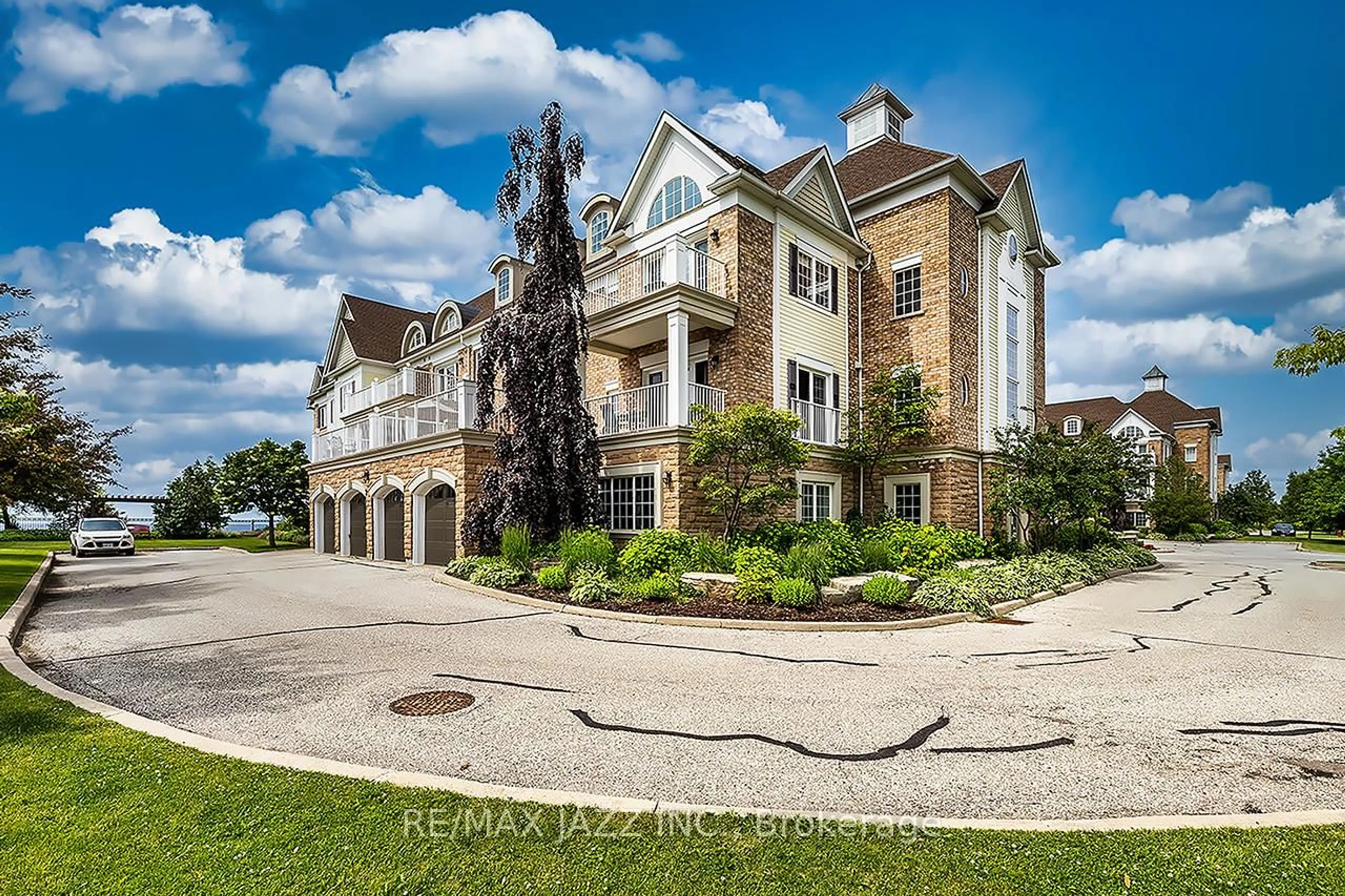 A pic from outside/outdoor area/front of a property/back of a property/a pic from drone, water/lake/river/ocean view for 375 Lakebreeze Dr #102, Clarington Ontario L1B 0A3