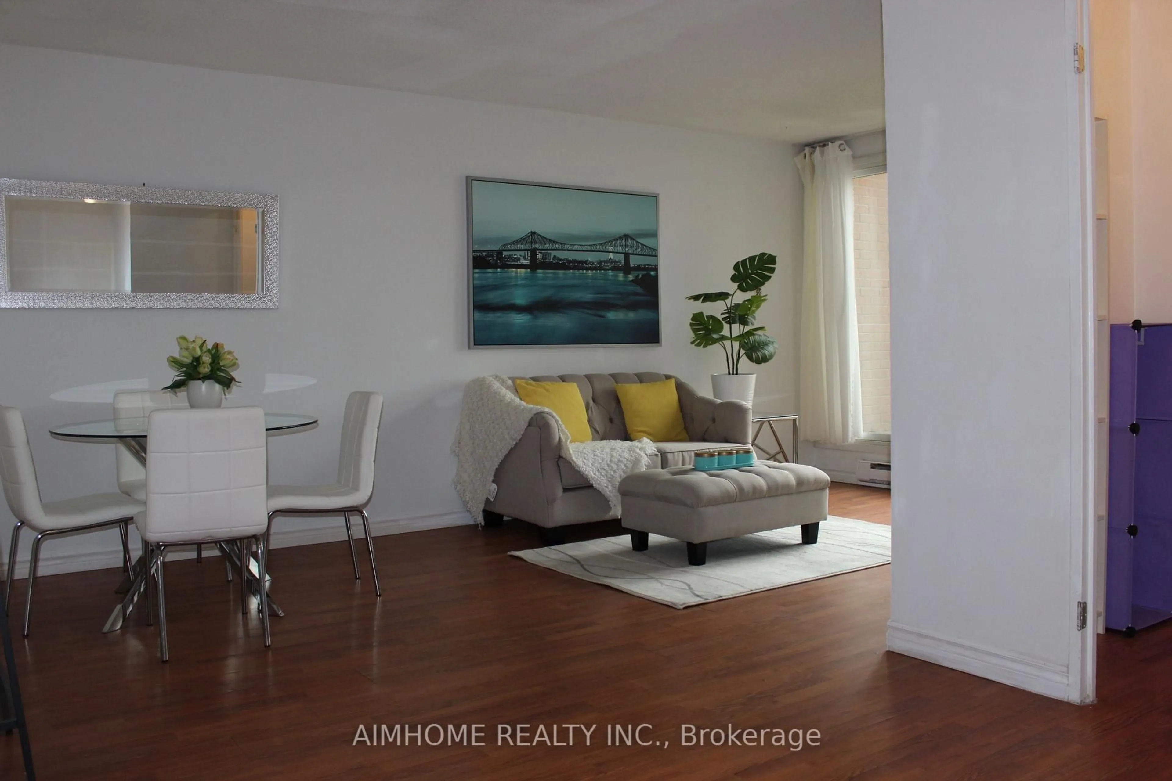 Living room with furniture, wood/laminate floor for 100 Mornelle Crt #1086, Toronto Ontario M1E 4X2