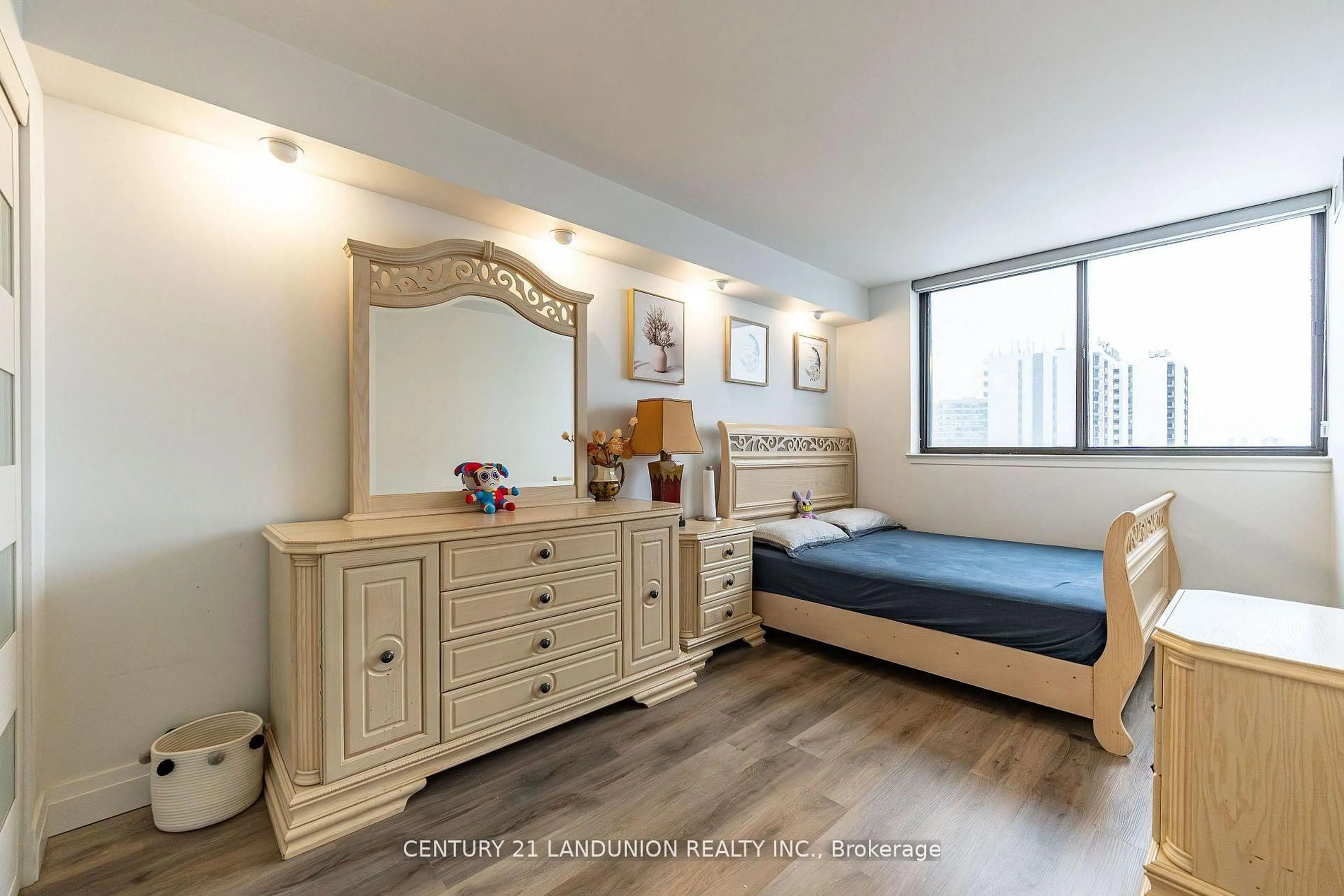 Bedroom with bed, wood/laminate floor for 55 Bamburgh Circ #1209, Toronto Ontario M1W 3V4