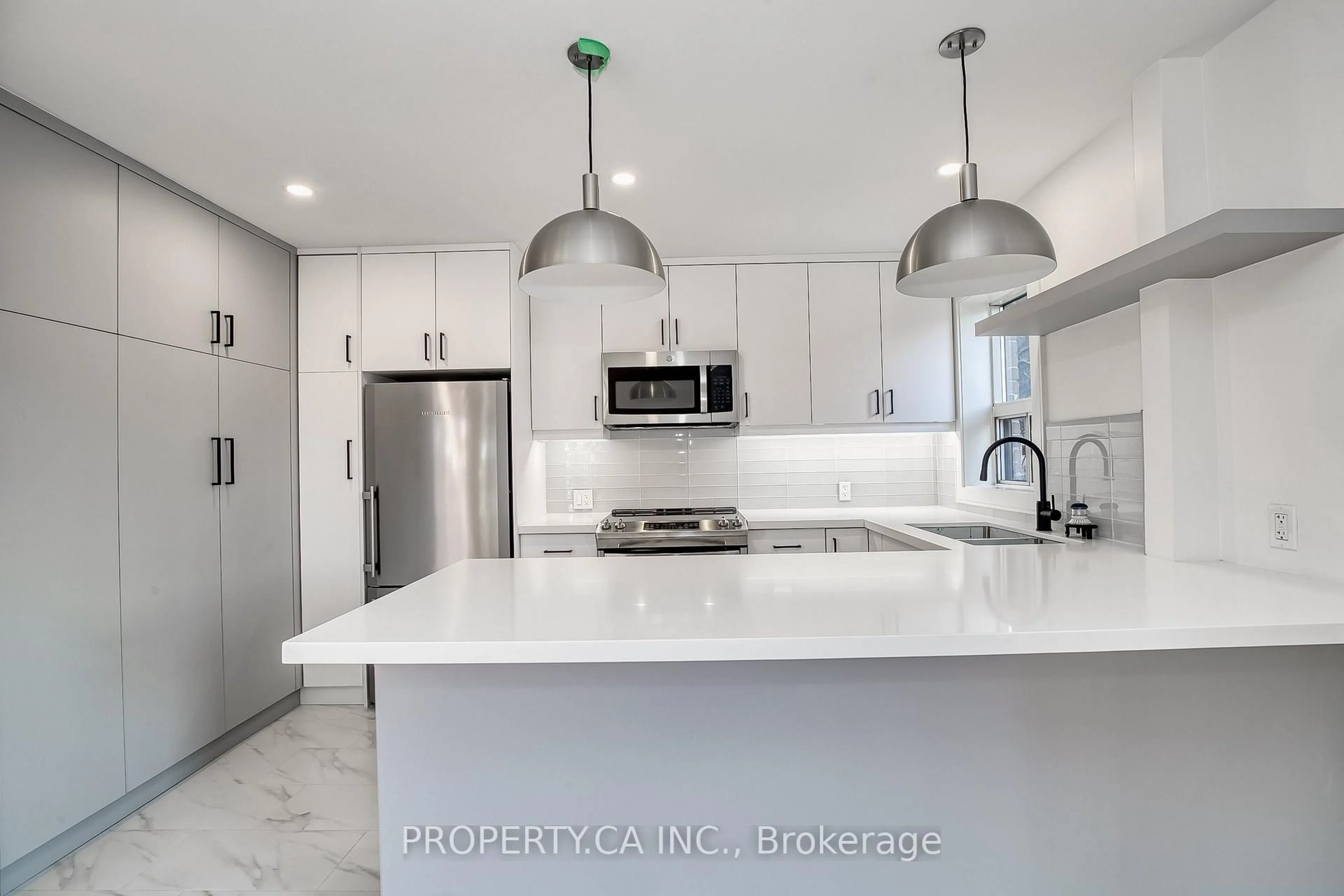 Open concept kitchen, ceramic/tile floor for 97 Lee Ave, Toronto Ontario M4E 2P2