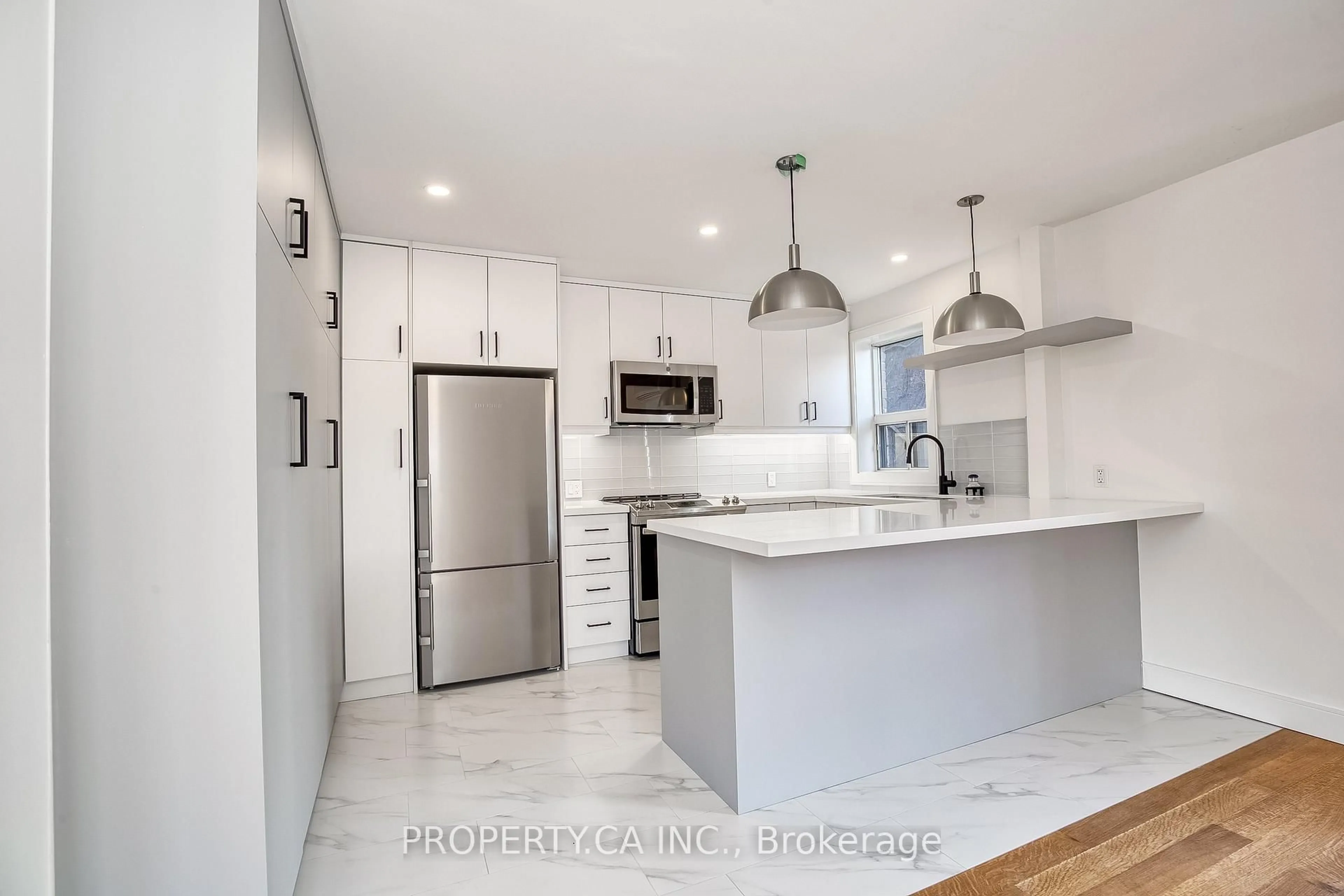 Open concept kitchen, ceramic/tile floor for 97 Lee Ave, Toronto Ontario M4E 2P2