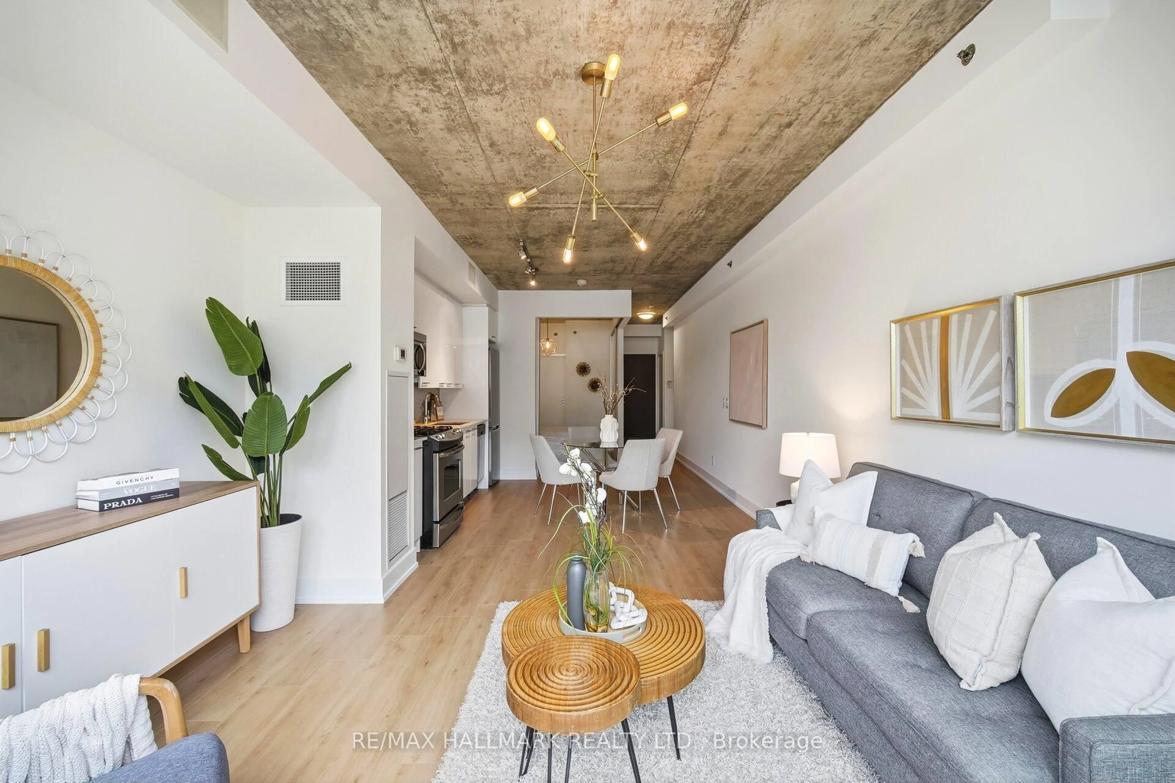 Living room with furniture, cement floor for 630 Queen St #511, Toronto Ontario M4M 1G3