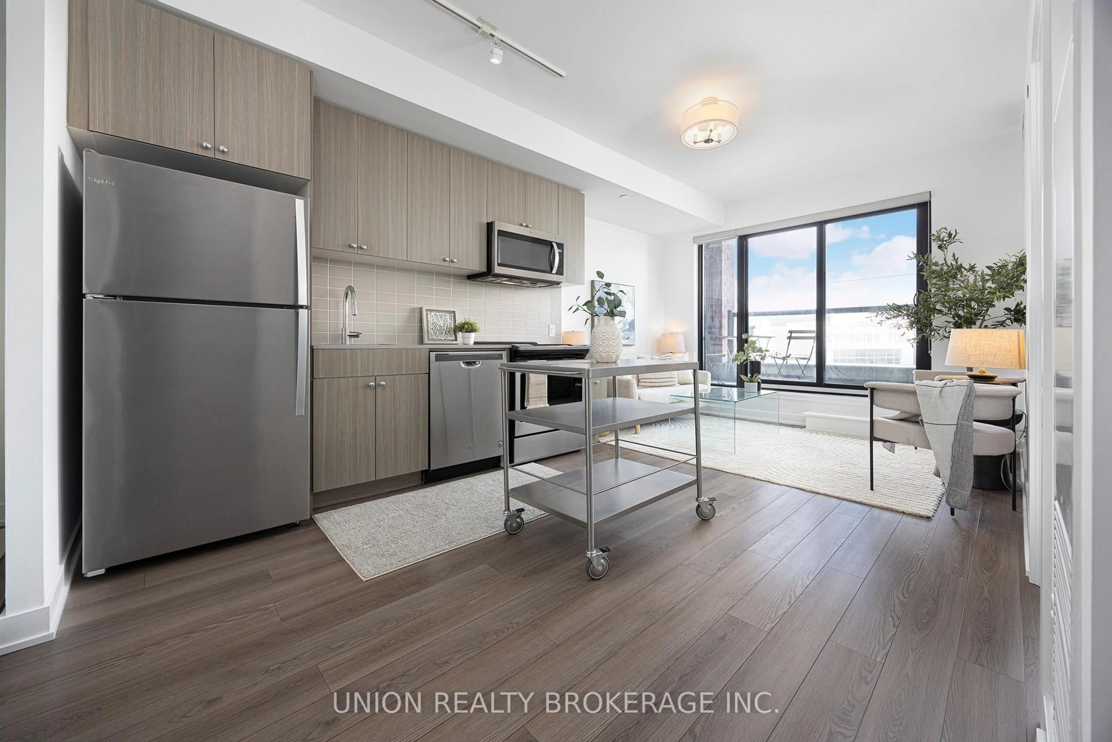 Open concept kitchen, wood/laminate floor for 2799 Kingston Rd Rd #211, Toronto Ontario M1M 0E3