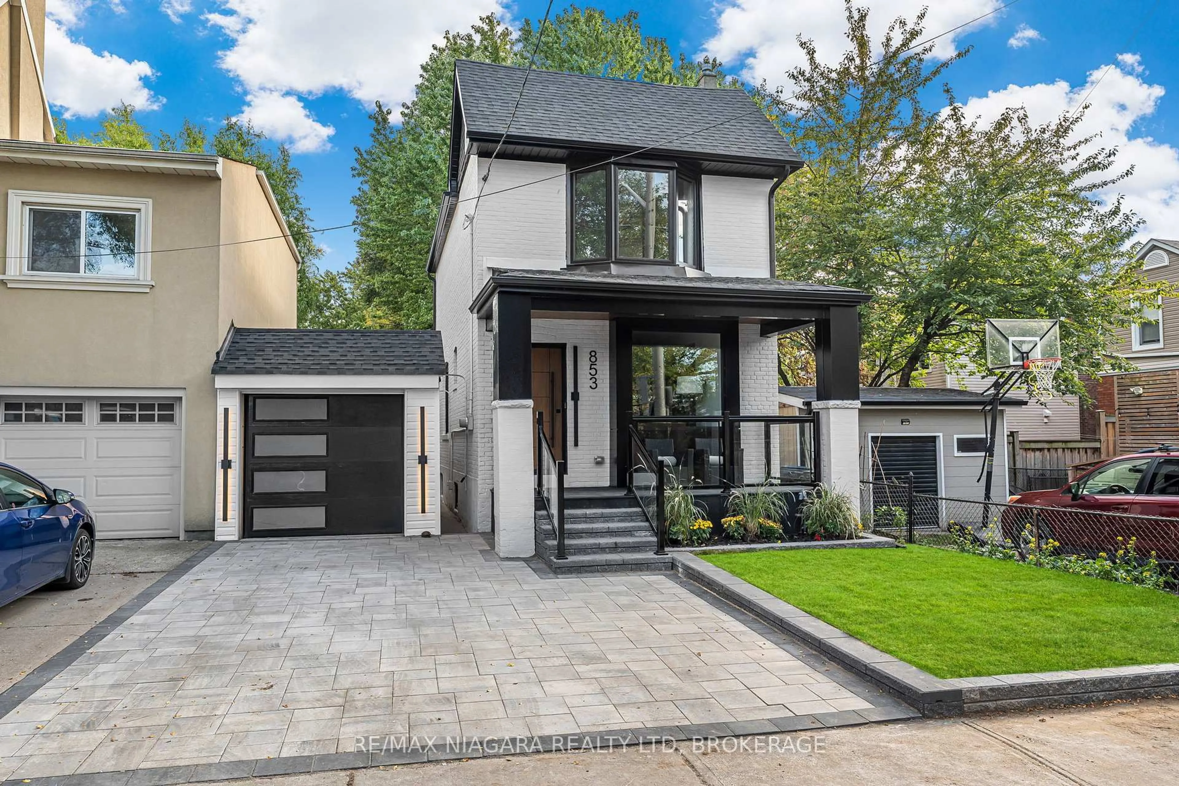 Home with brick exterior material, street for 853 Sammon Ave, Toronto Ontario M4C 2E9