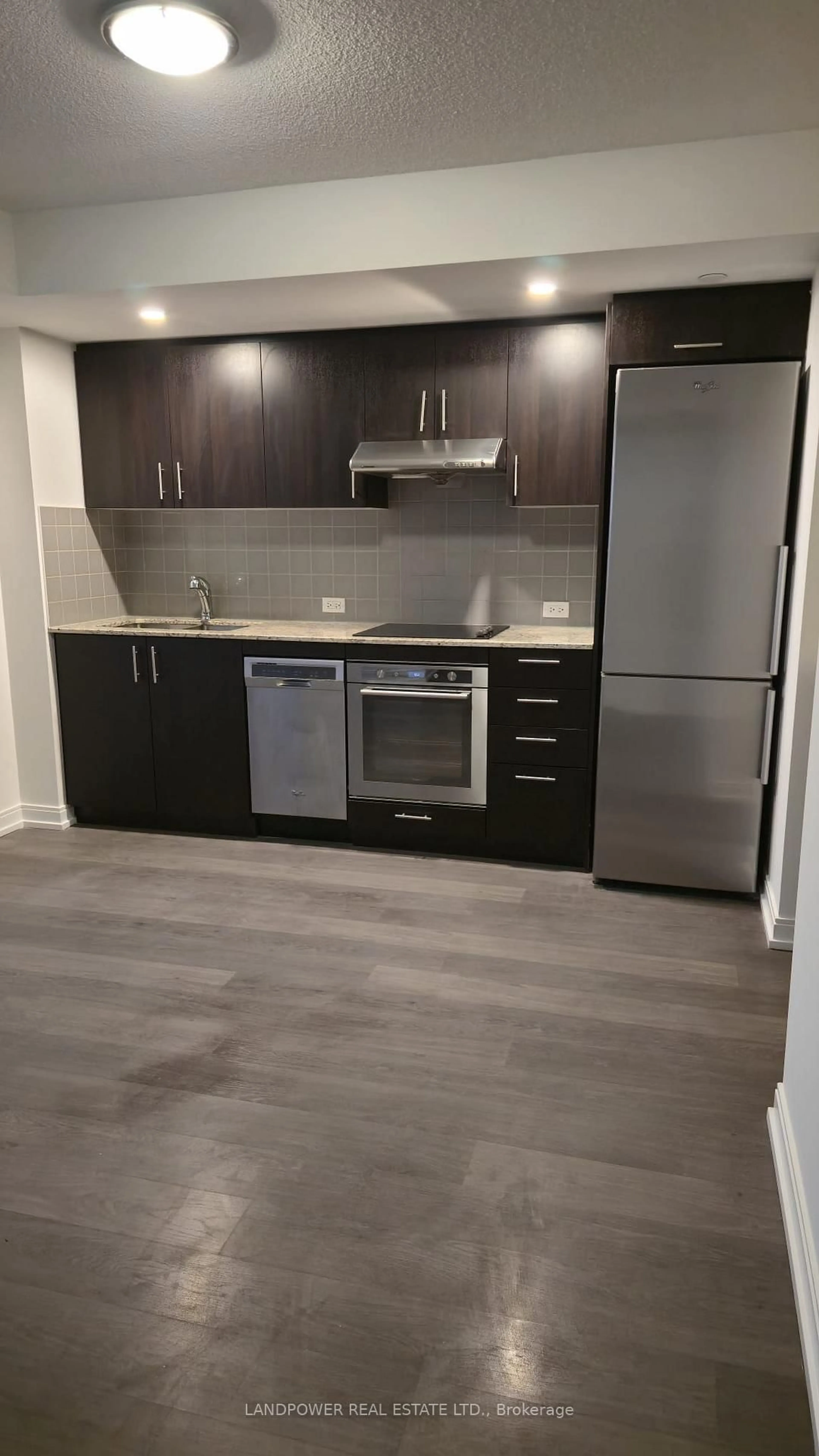 Standard kitchen, wood/laminate floor for 255 Village Green Sq #708, Toronto Ontario M1S 0L7
