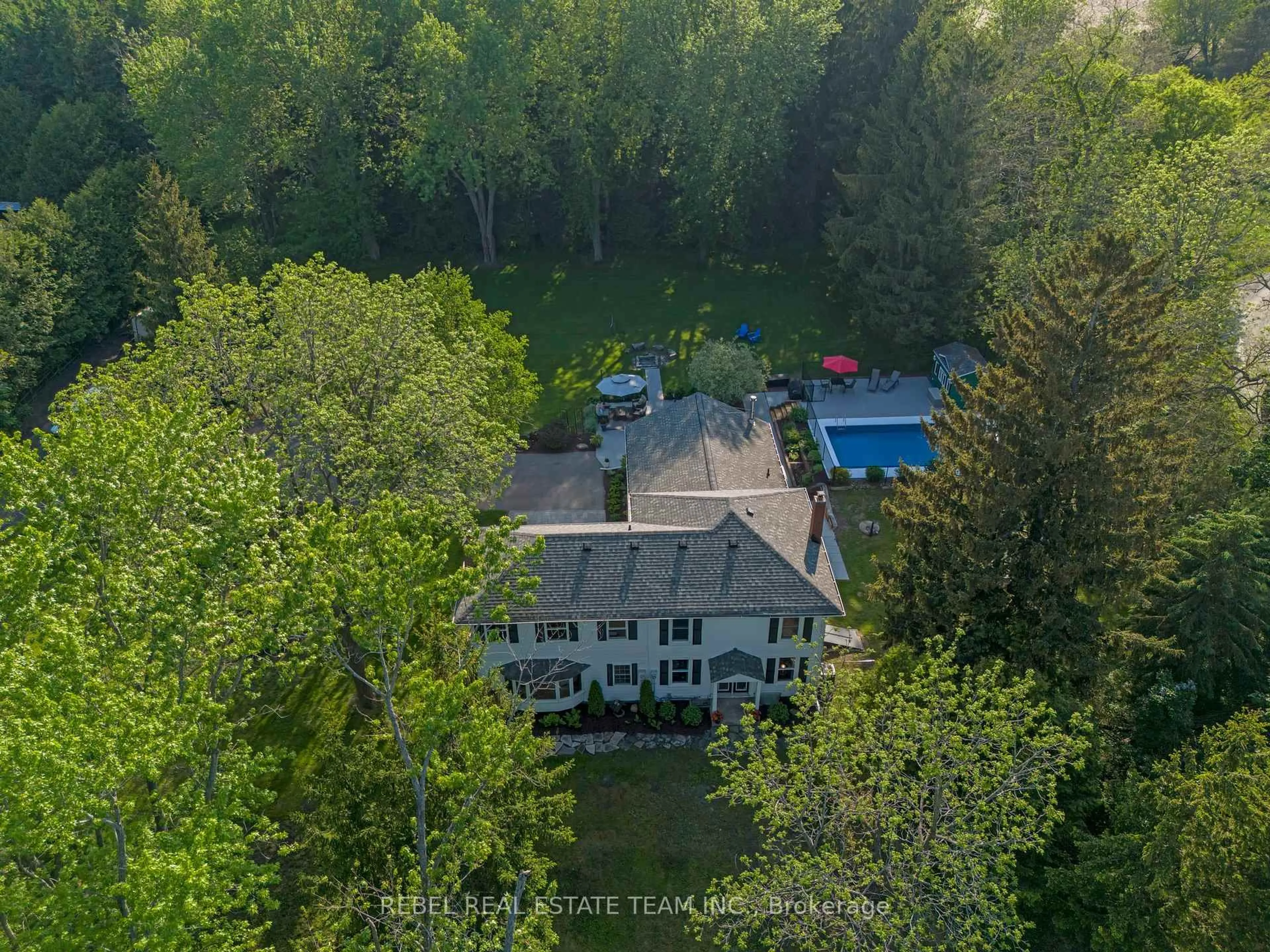 A pic from outside/outdoor area/front of a property/back of a property/a pic from drone, forest/trees view for 5462 Main St, Clarington Ontario L0B 1M0