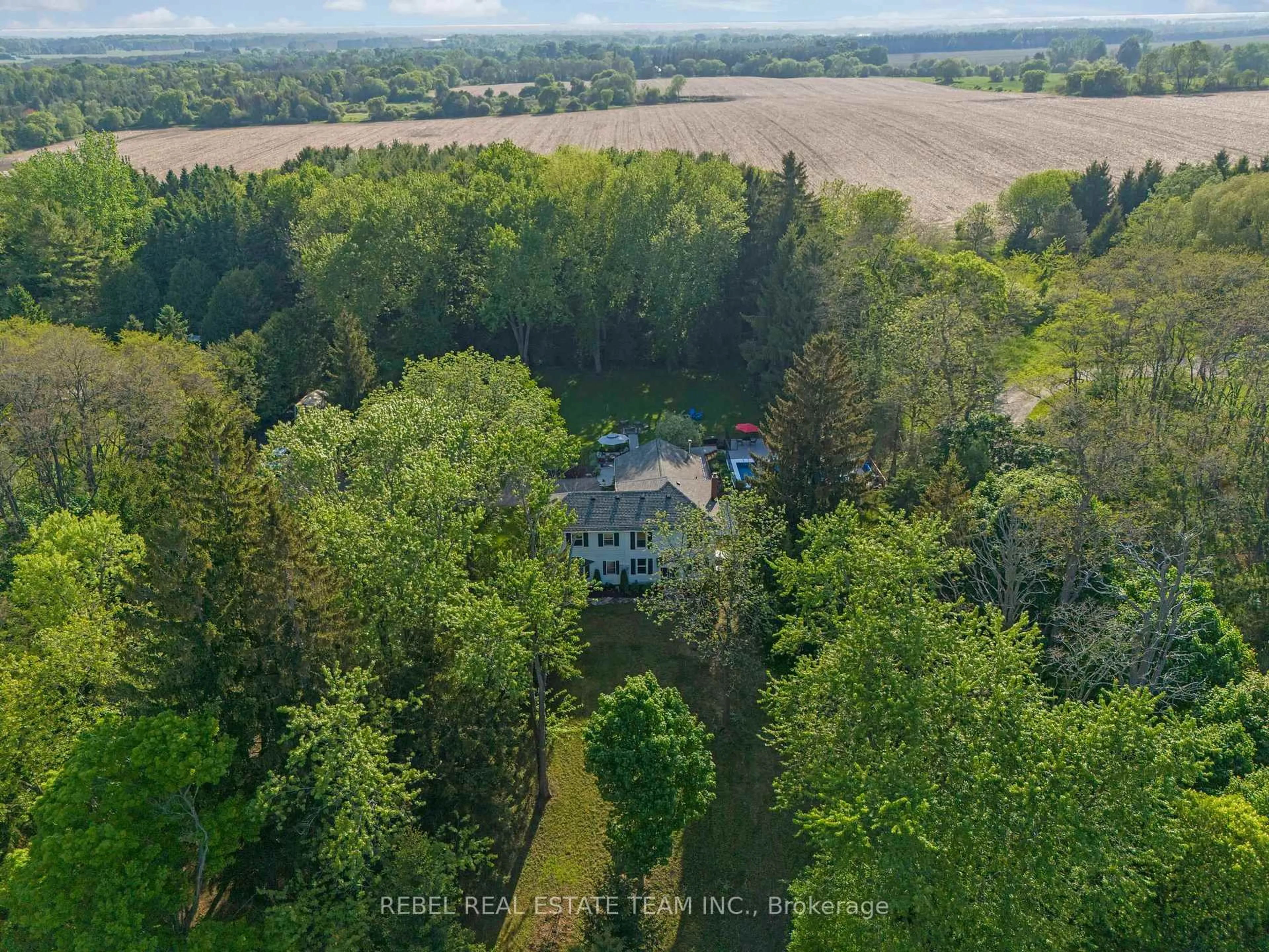 A pic from outside/outdoor area/front of a property/back of a property/a pic from drone, forest/trees view for 5462 Main St, Clarington Ontario L0B 1M0