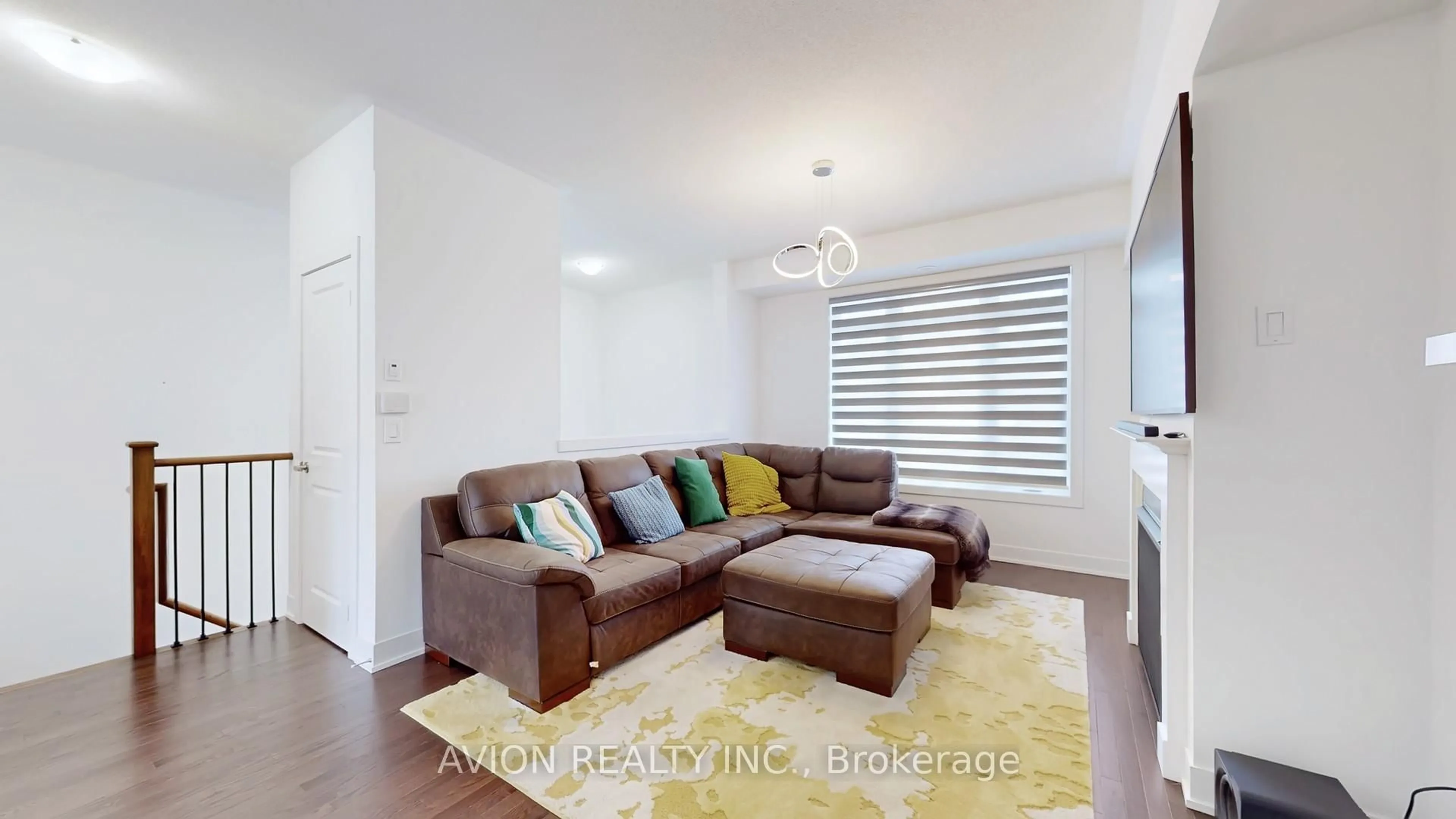 Living room with furniture, wood/laminate floor for 7 Elkington Cres, Whitby Ontario L1P 0L7