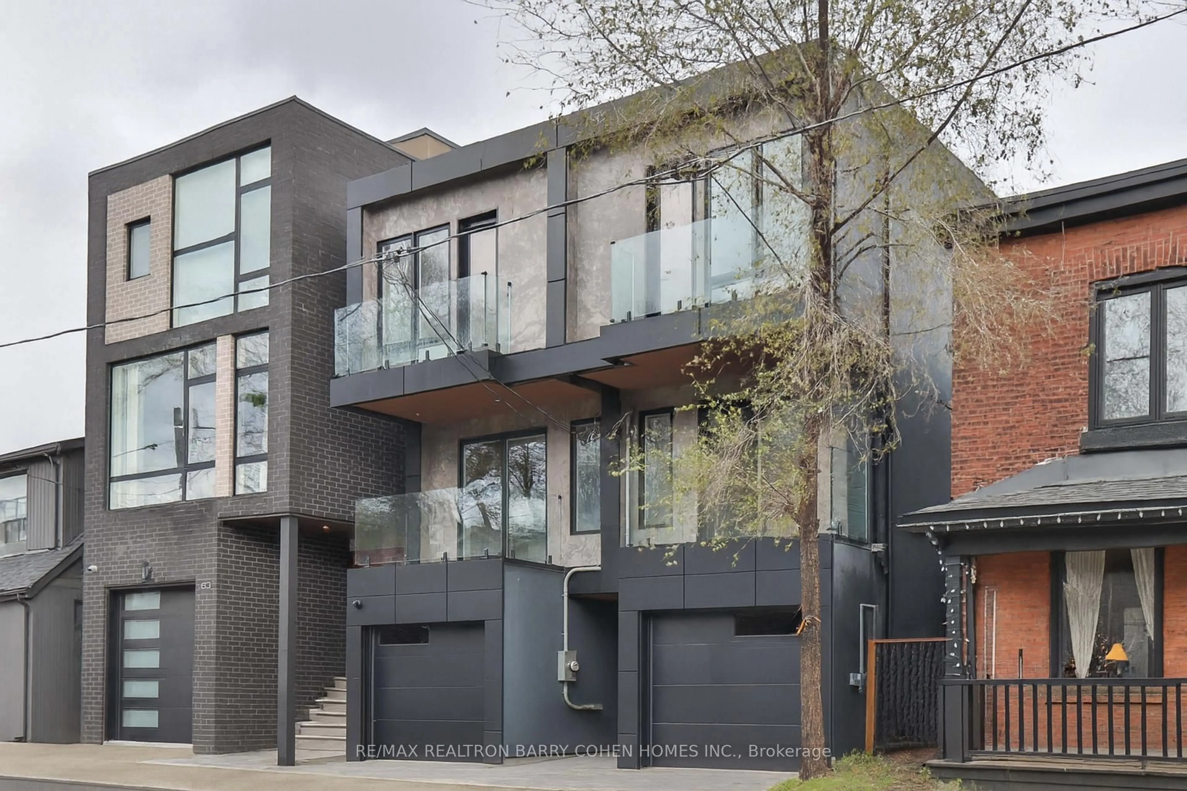 Home with brick exterior material, street for 57 Jones Ave, Toronto Ontario M4M 2Z7