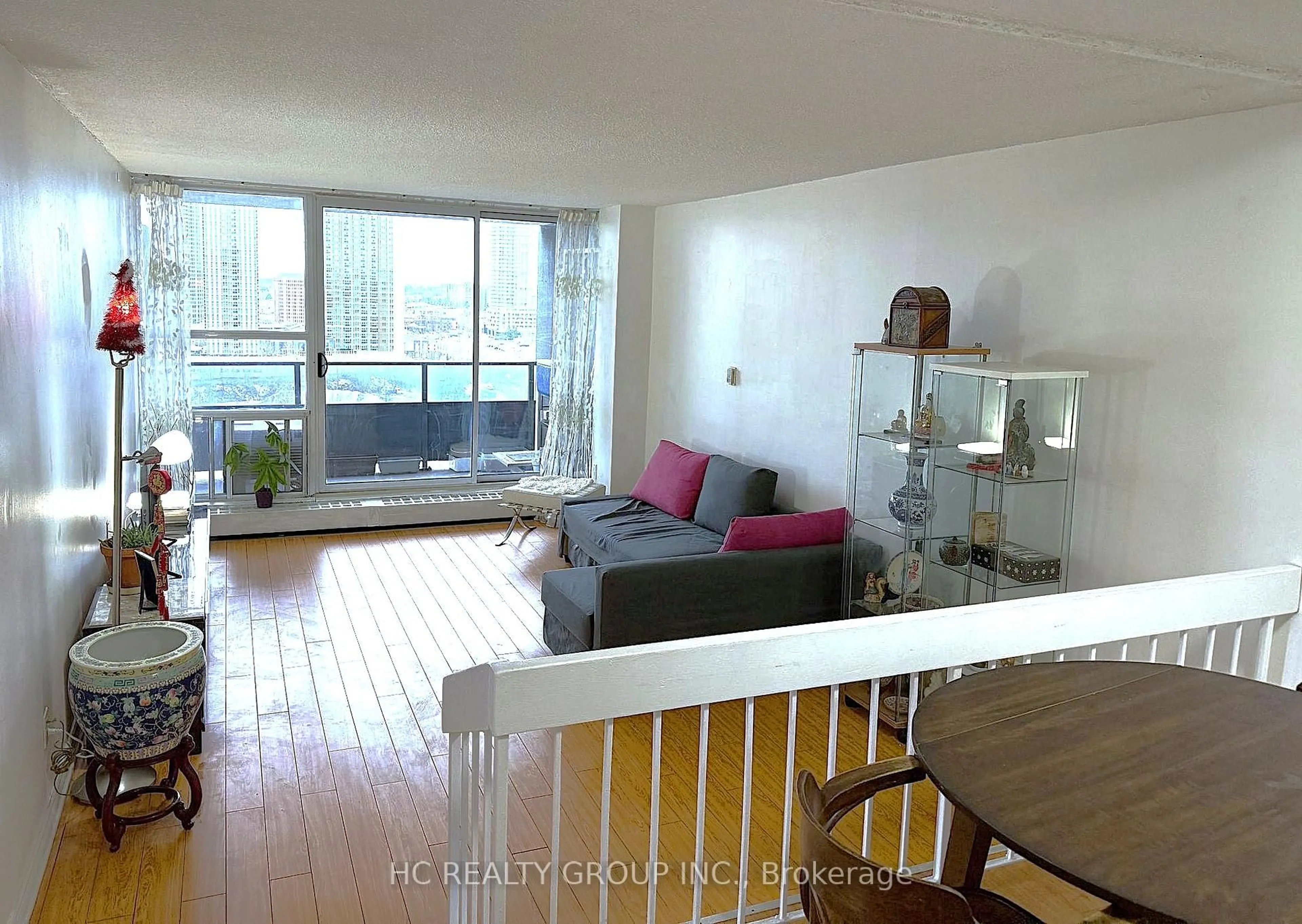 Living room with furniture, wood/laminate floor for 4091 Sheppard Ave #1705, Toronto Ontario M1S 3H2