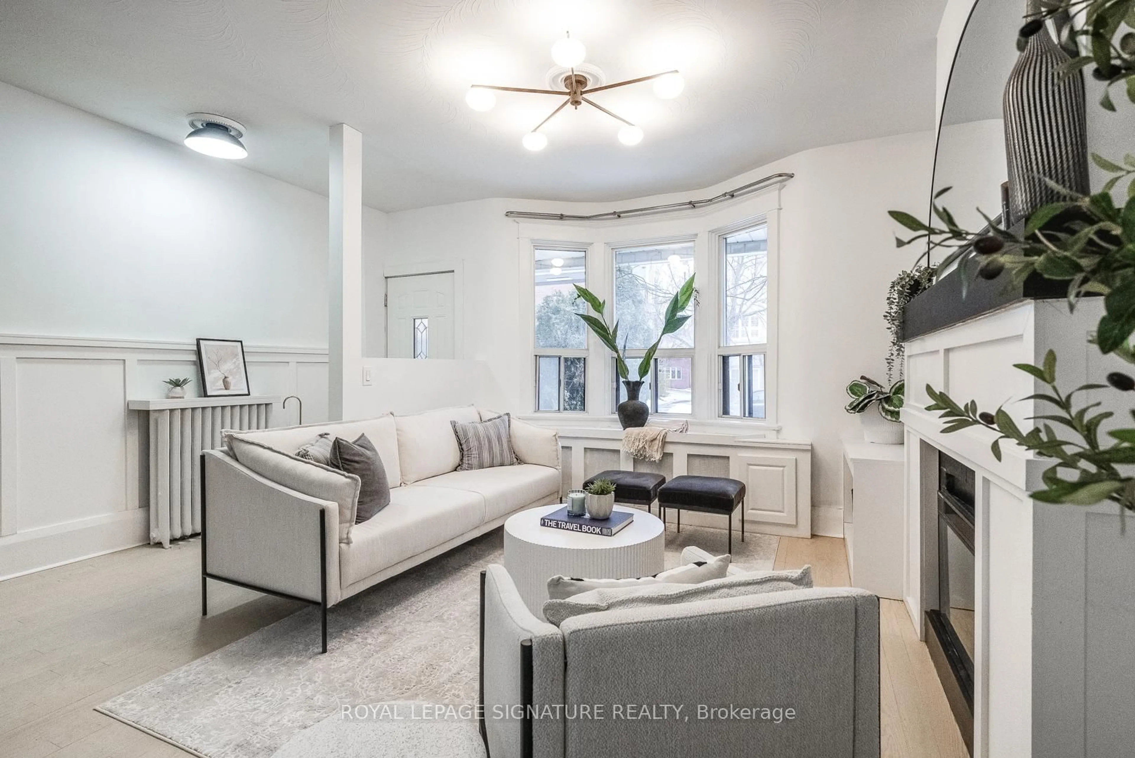 Living room with furniture, ceramic/tile floor for 216 Parkmount Rd, Toronto Ontario M4J 4V6