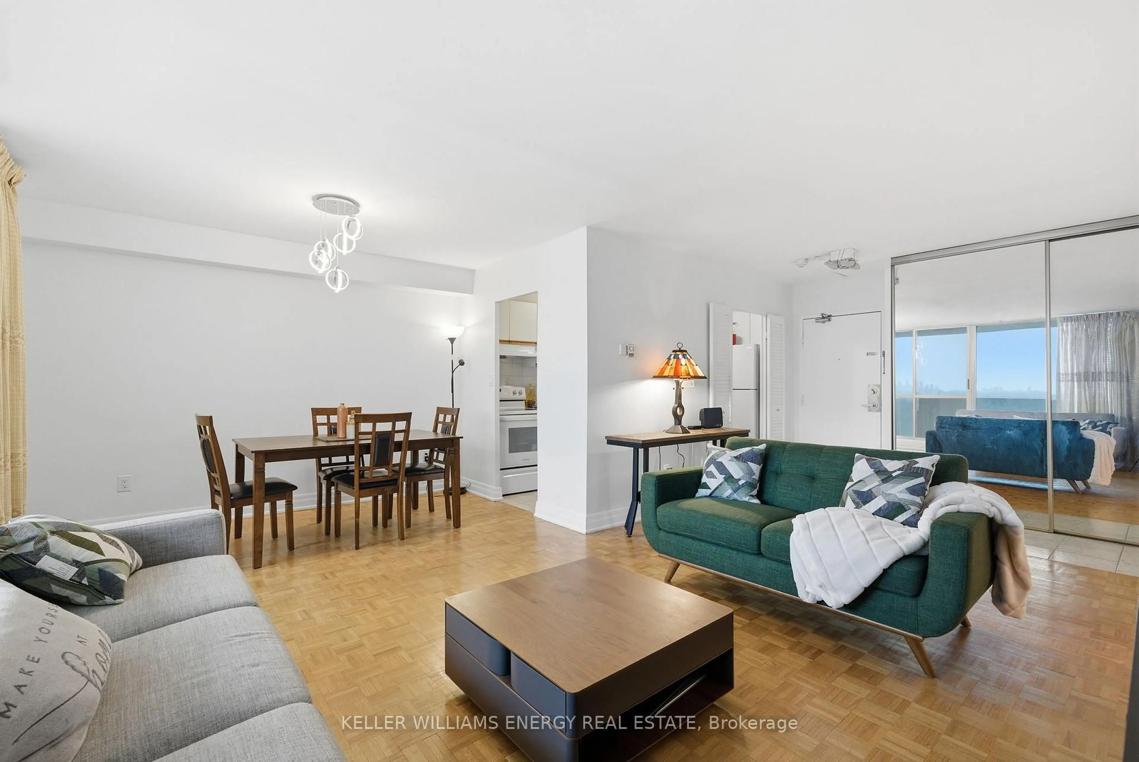 Living room with furniture, wood/laminate floor for 1 Massey Sq #1514, Toronto Ontario M4C 5L4