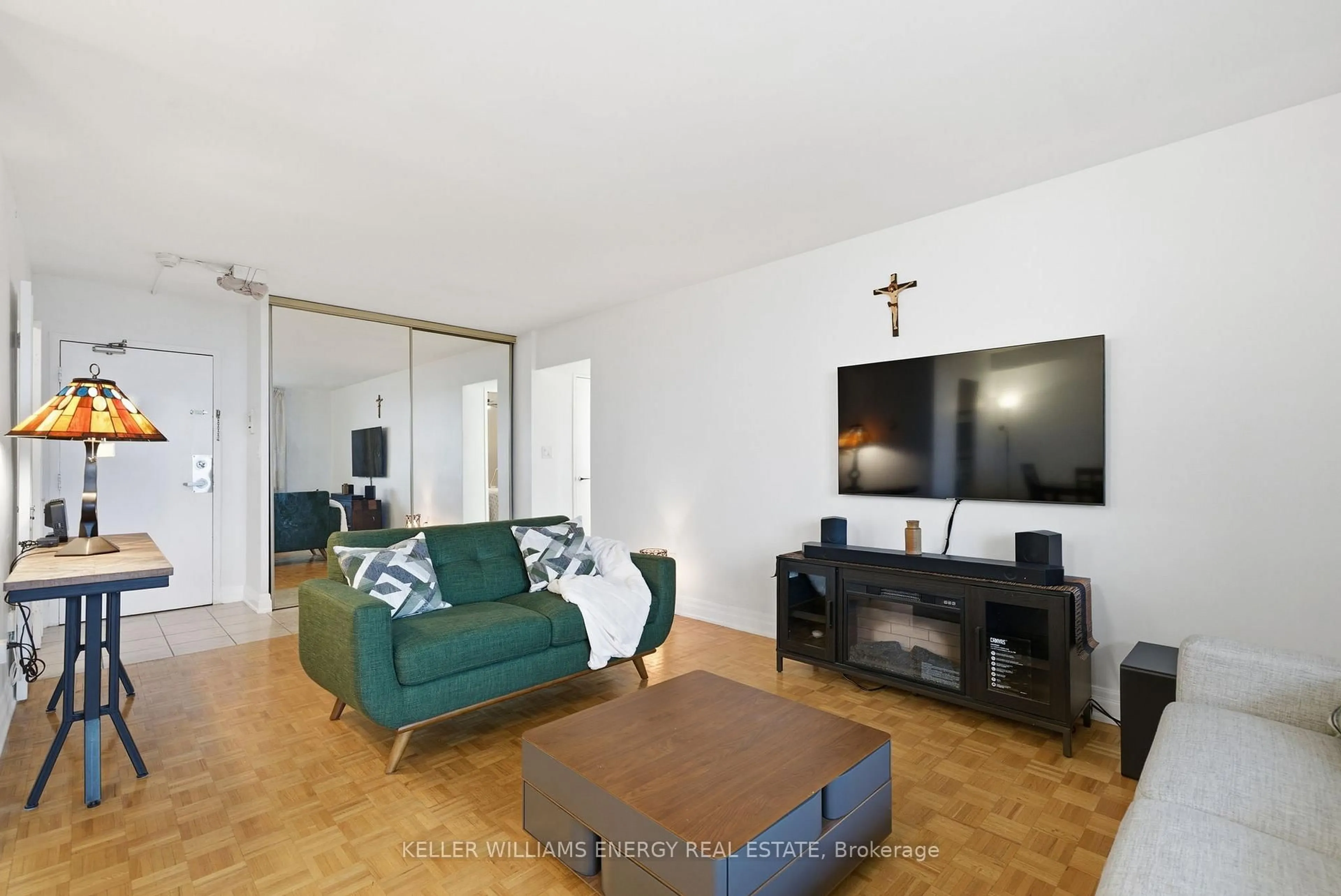 Living room with furniture, wood/laminate floor for 1 Massey Sq #1514, Toronto Ontario M4C 5L4