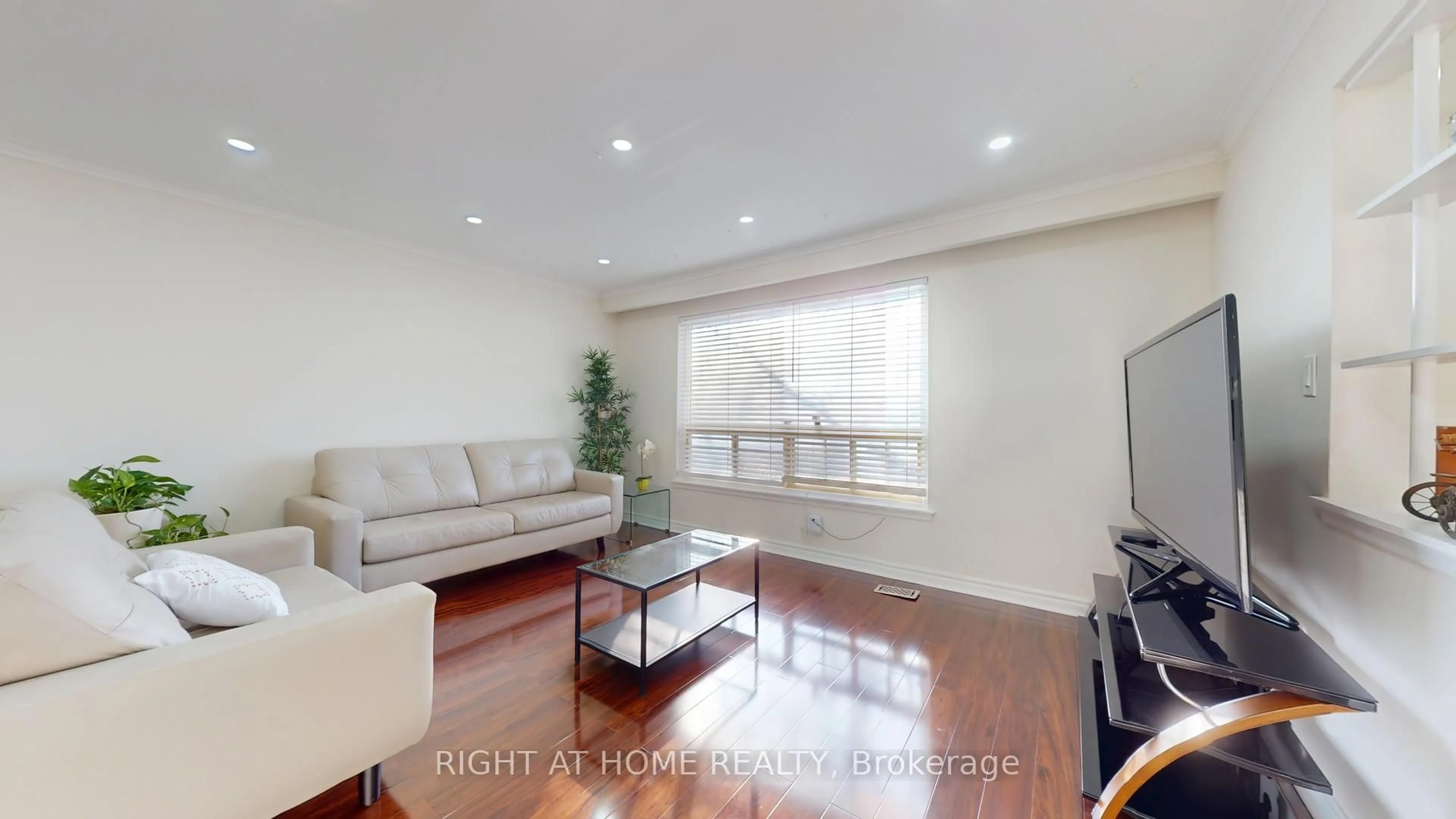 Living room with furniture, wood/laminate floor for 99 Poplar Rd, Toronto Ontario M1E 1Z5