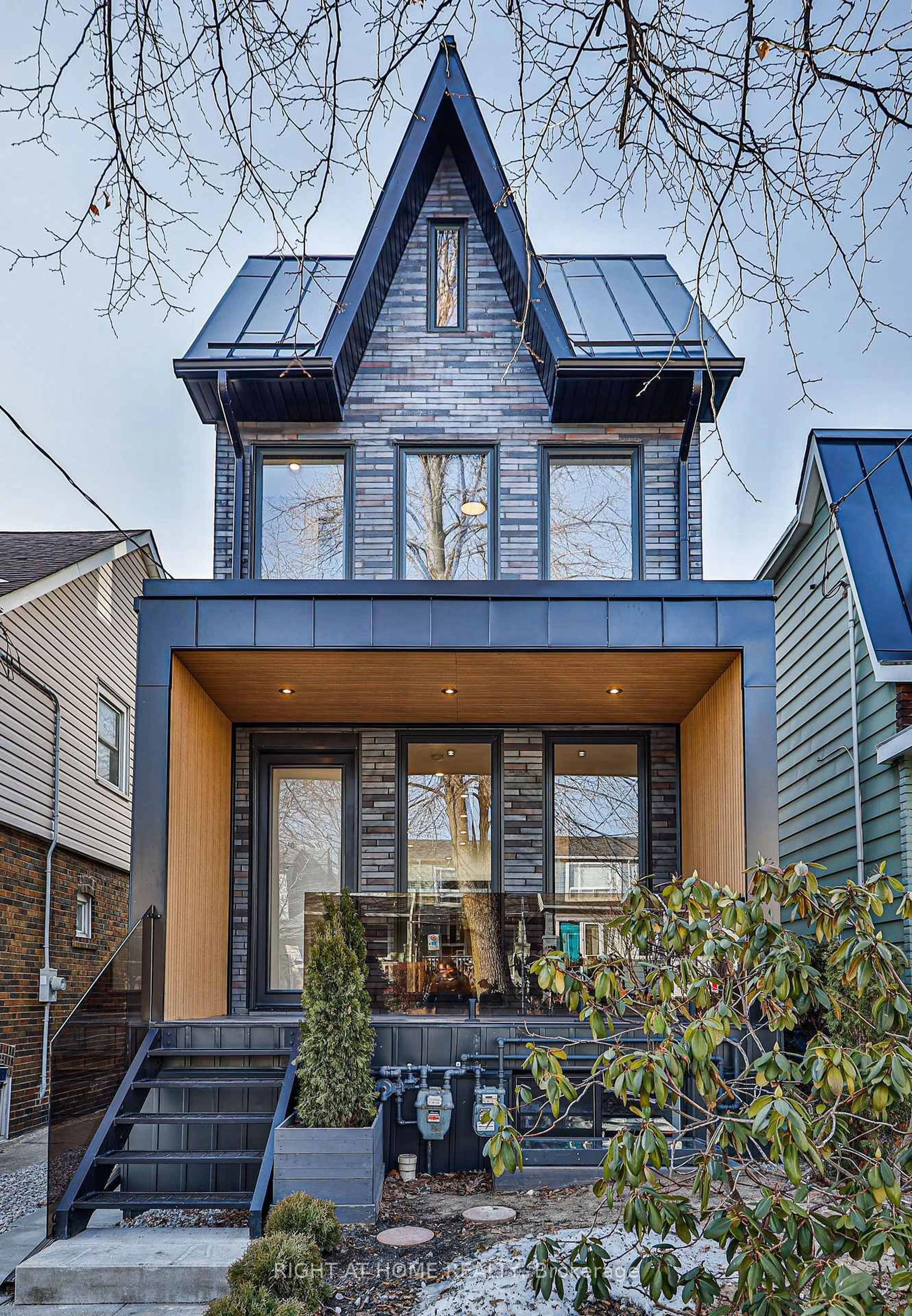 Home with brick exterior material, street for 11 Merrill Ave #MAIN AND LANEWAY, Toronto Ontario M4C 1C4