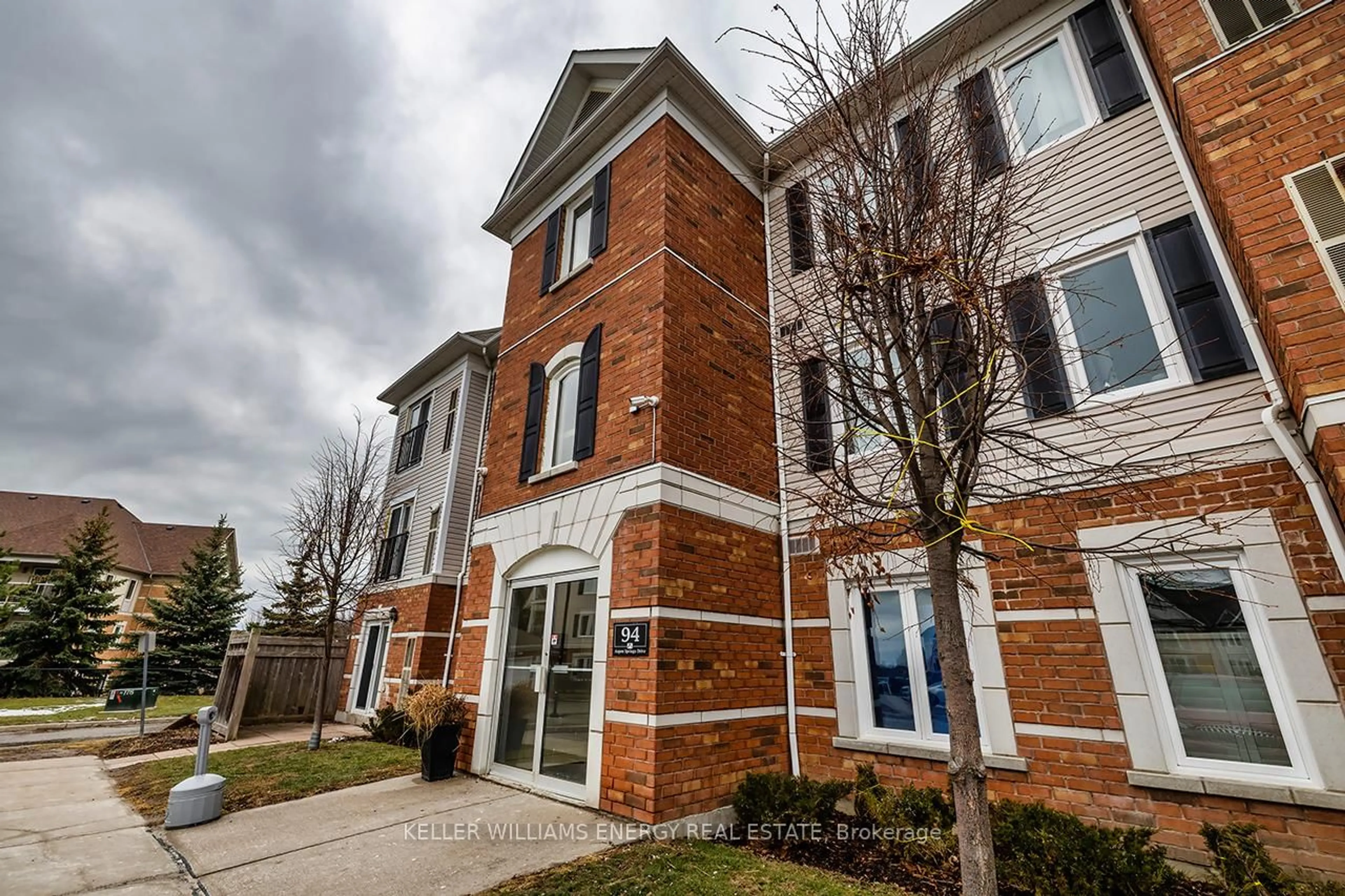 Home with brick exterior material, street for 94 Aspen Springs Dr #104, Clarington Ontario L1C 5N4