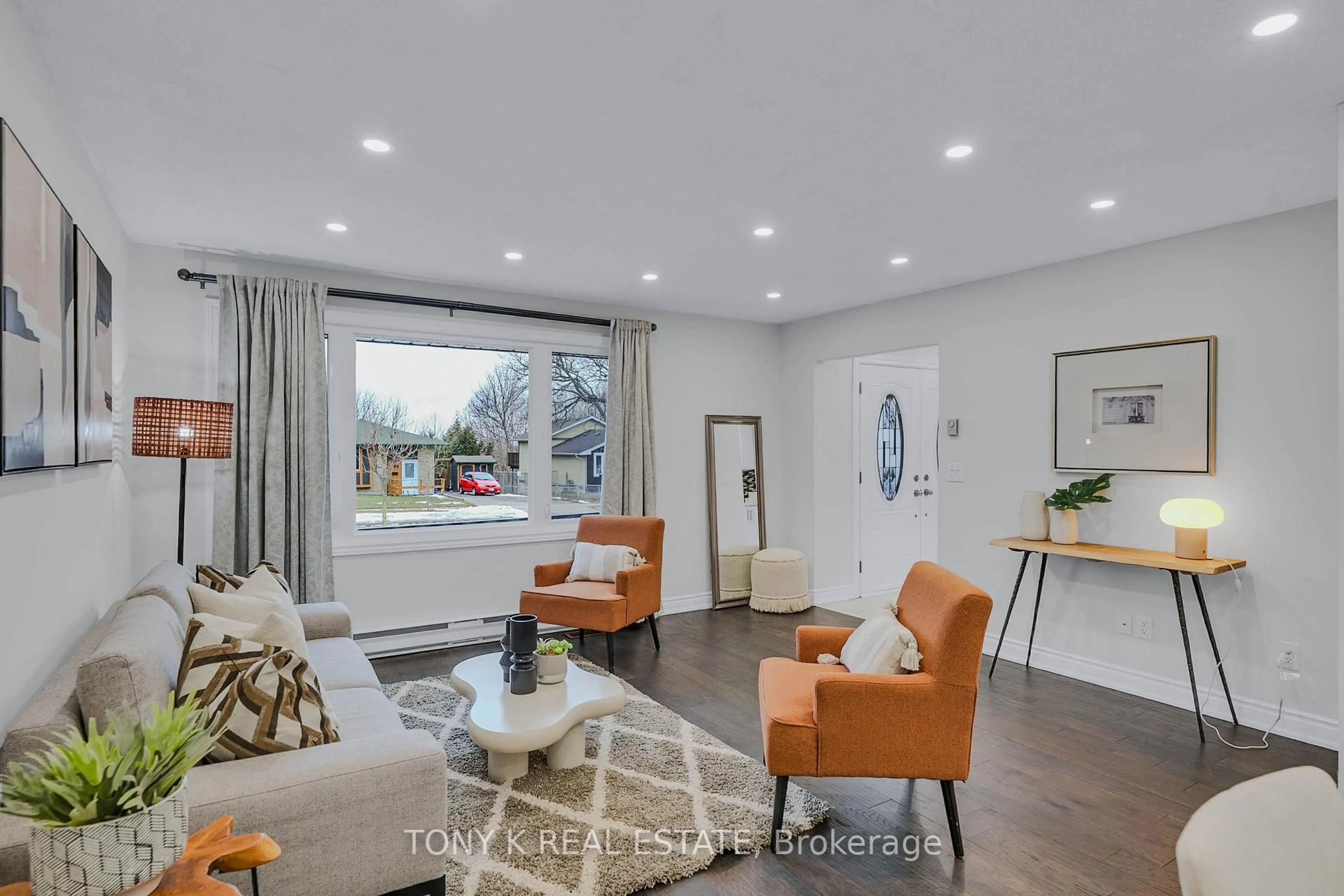 Living room with furniture, wood/laminate floor for 583 Annandale St, Oshawa Ontario L1H 7S6