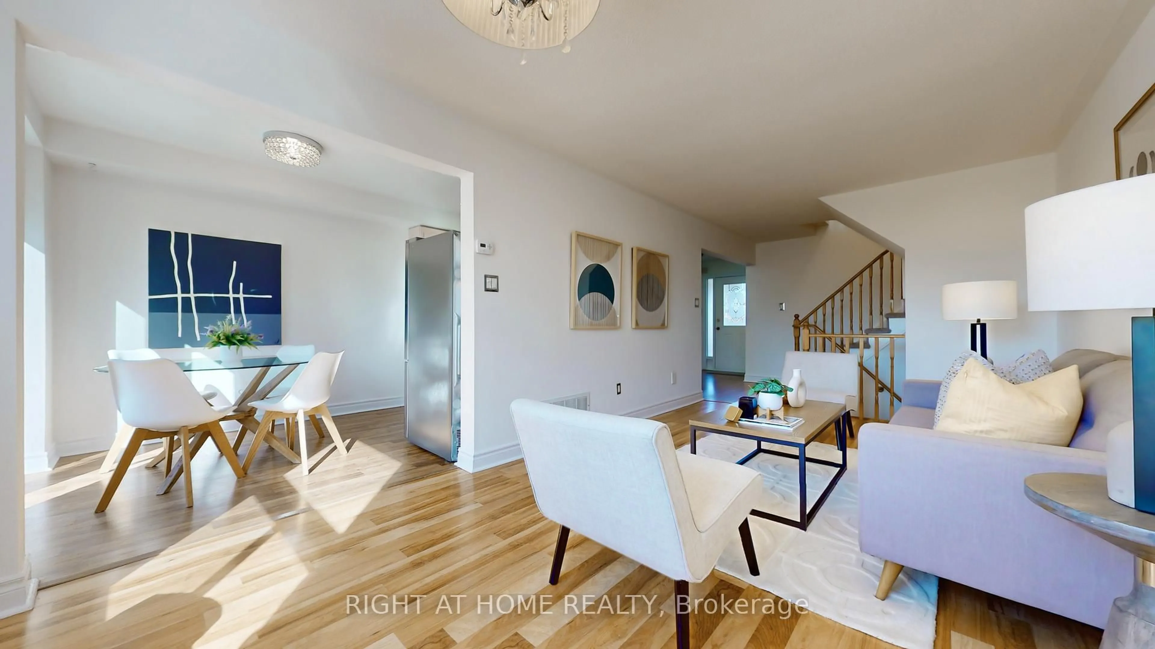 Living room with furniture, wood/laminate floor for 112 Creekwood Cres, Whitby Ontario L1R 2K4