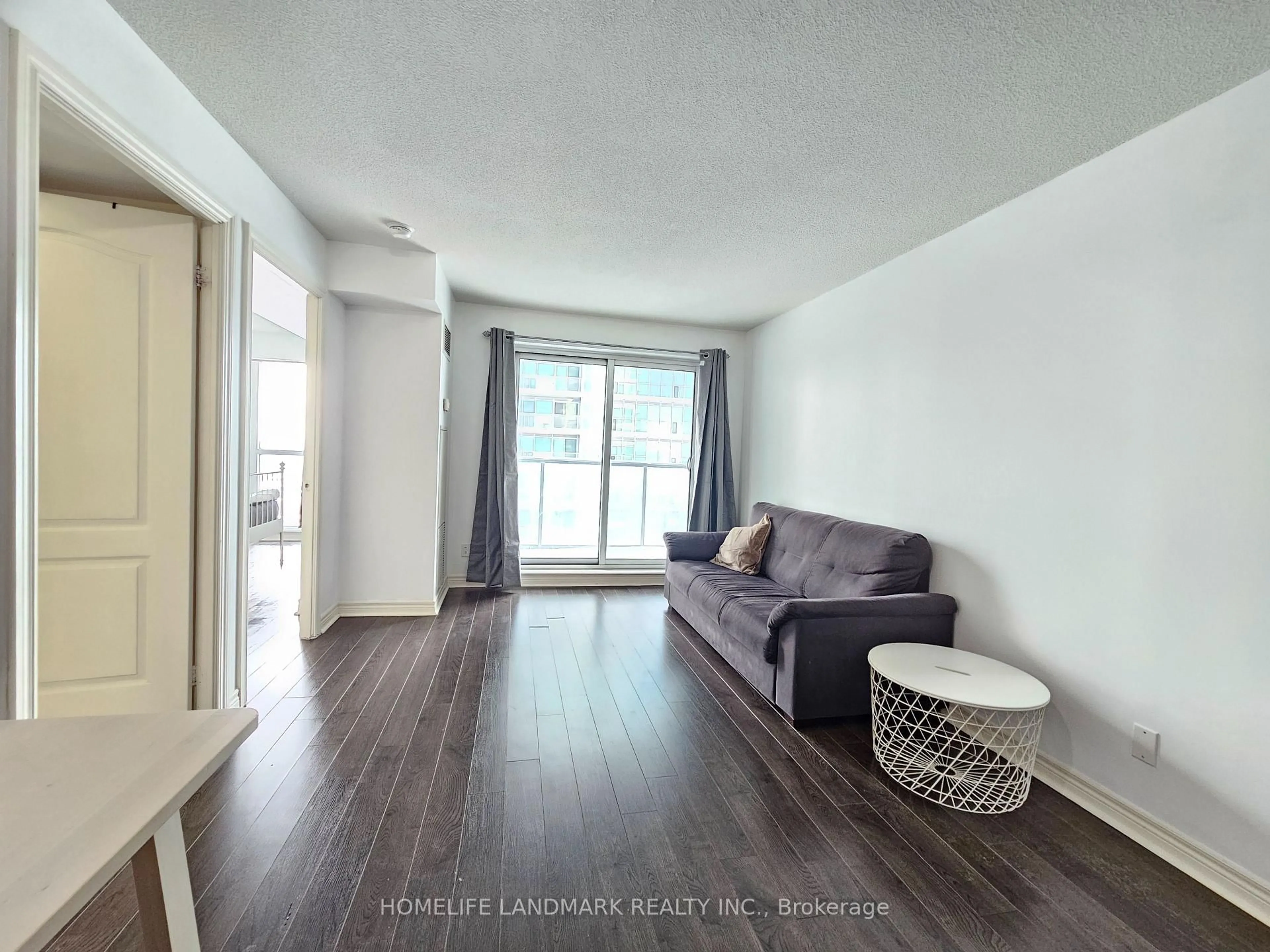 Living room with furniture, wood/laminate floor for 70 Town Centre Crt #1705, Toronto Ontario M1P 4Y7