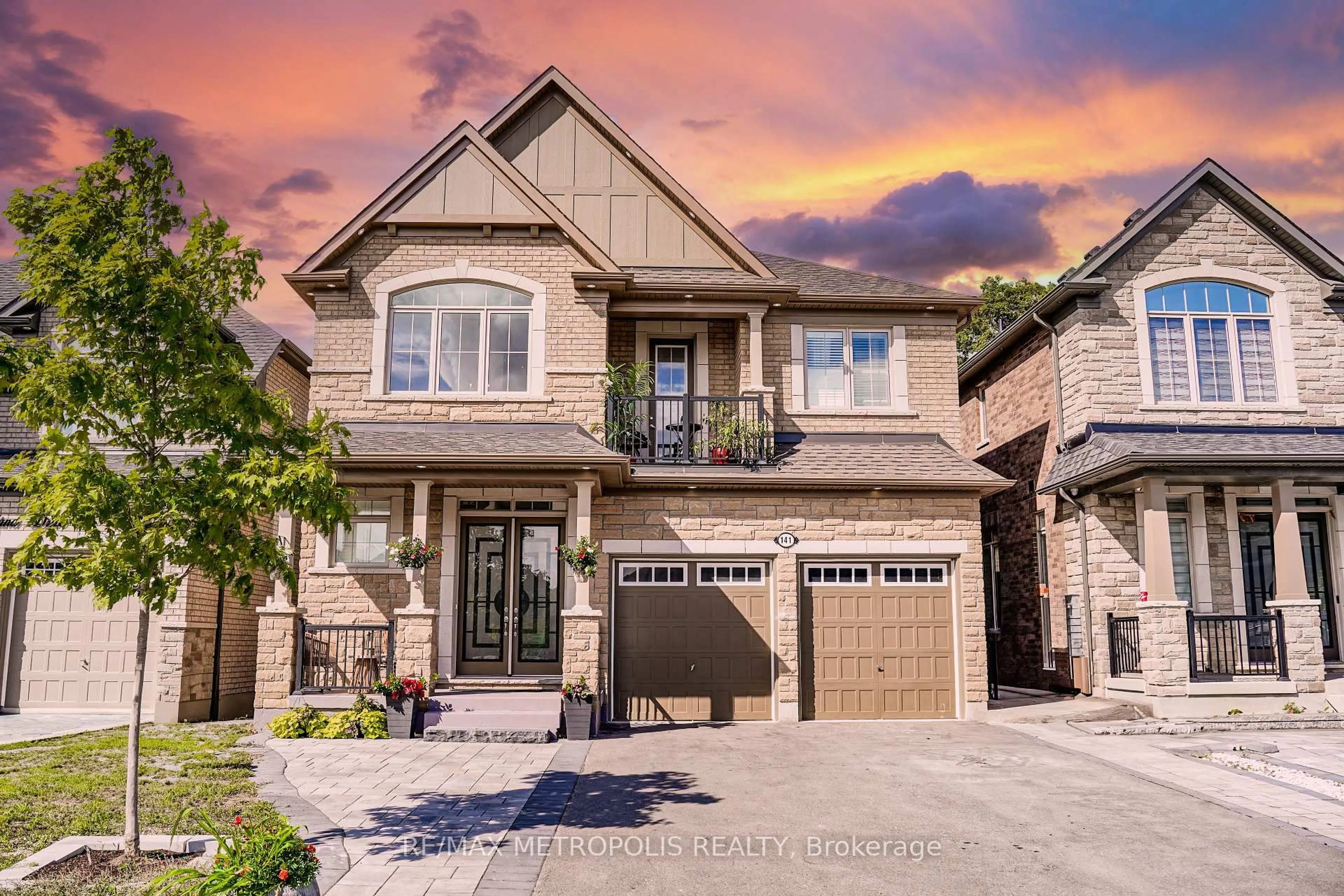 Home with brick exterior material, street for 141 AUCKLAND Dr, Whitby Ontario L1P 0J2