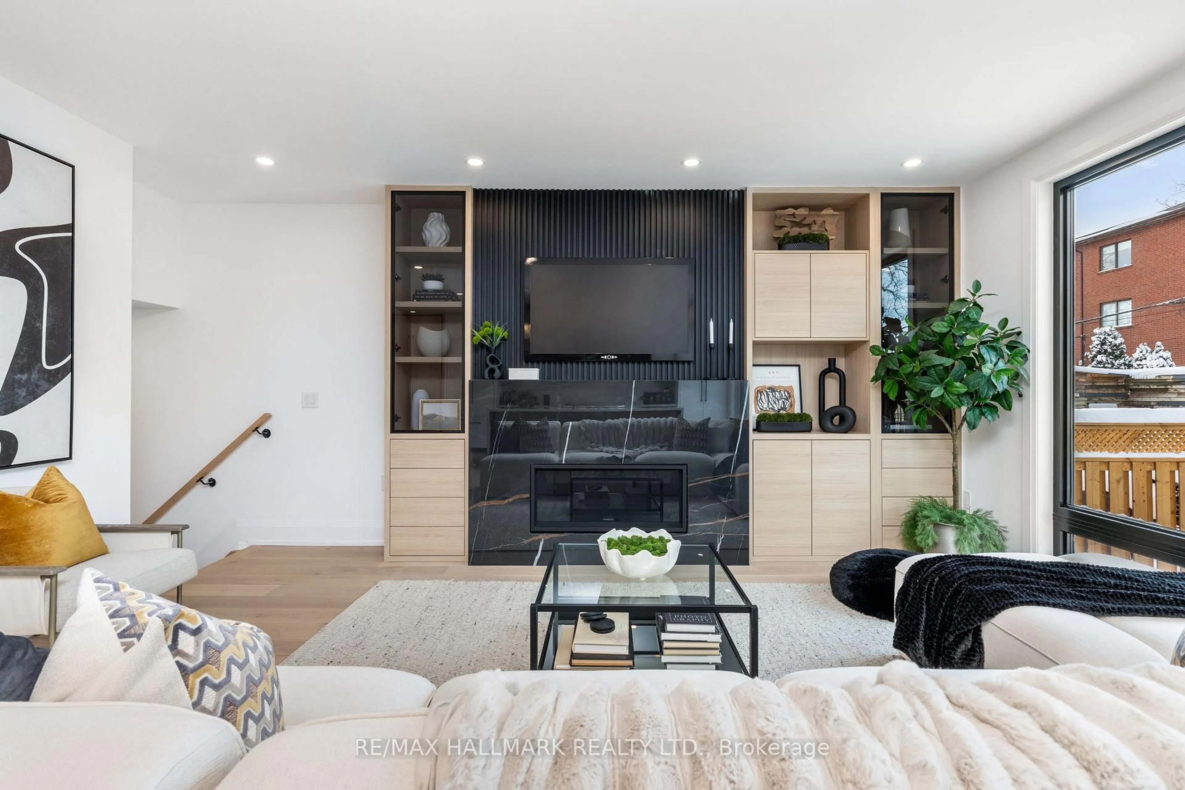 Living room with furniture, unknown for 68 Rhodes Ave, Toronto Ontario M4L 2Z9