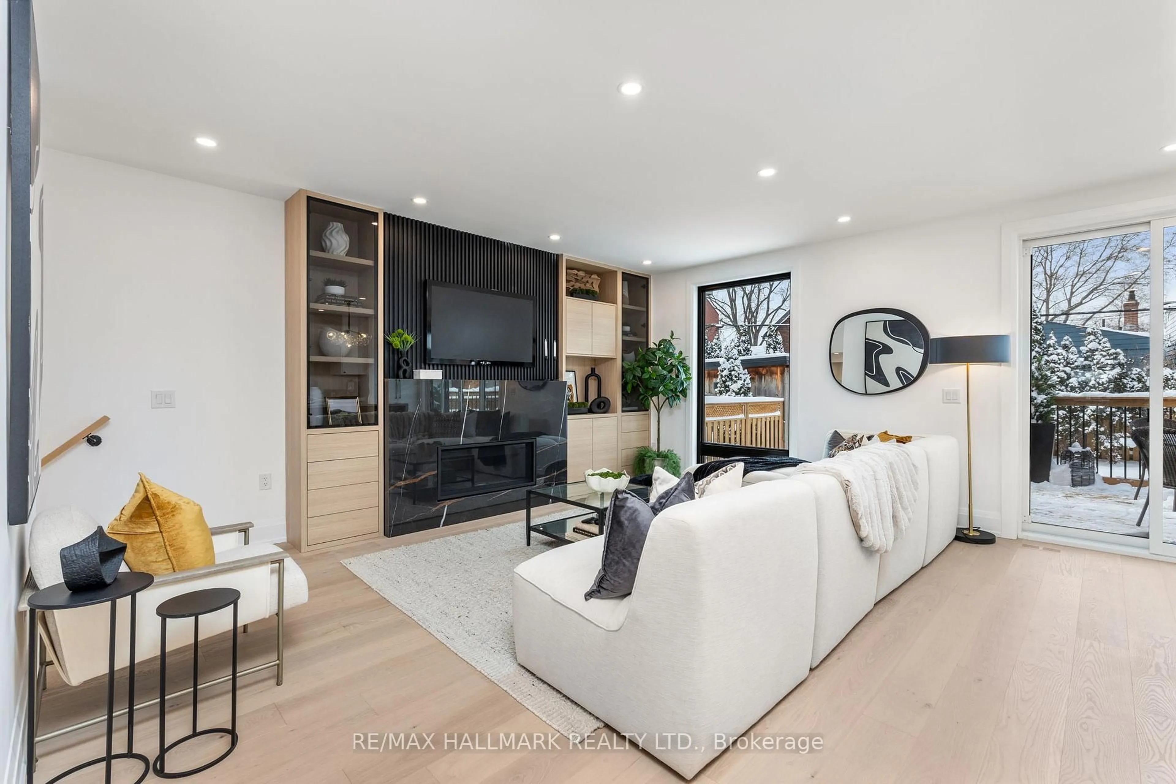 Living room with furniture, unknown for 68 Rhodes Ave, Toronto Ontario M4L 2Z9