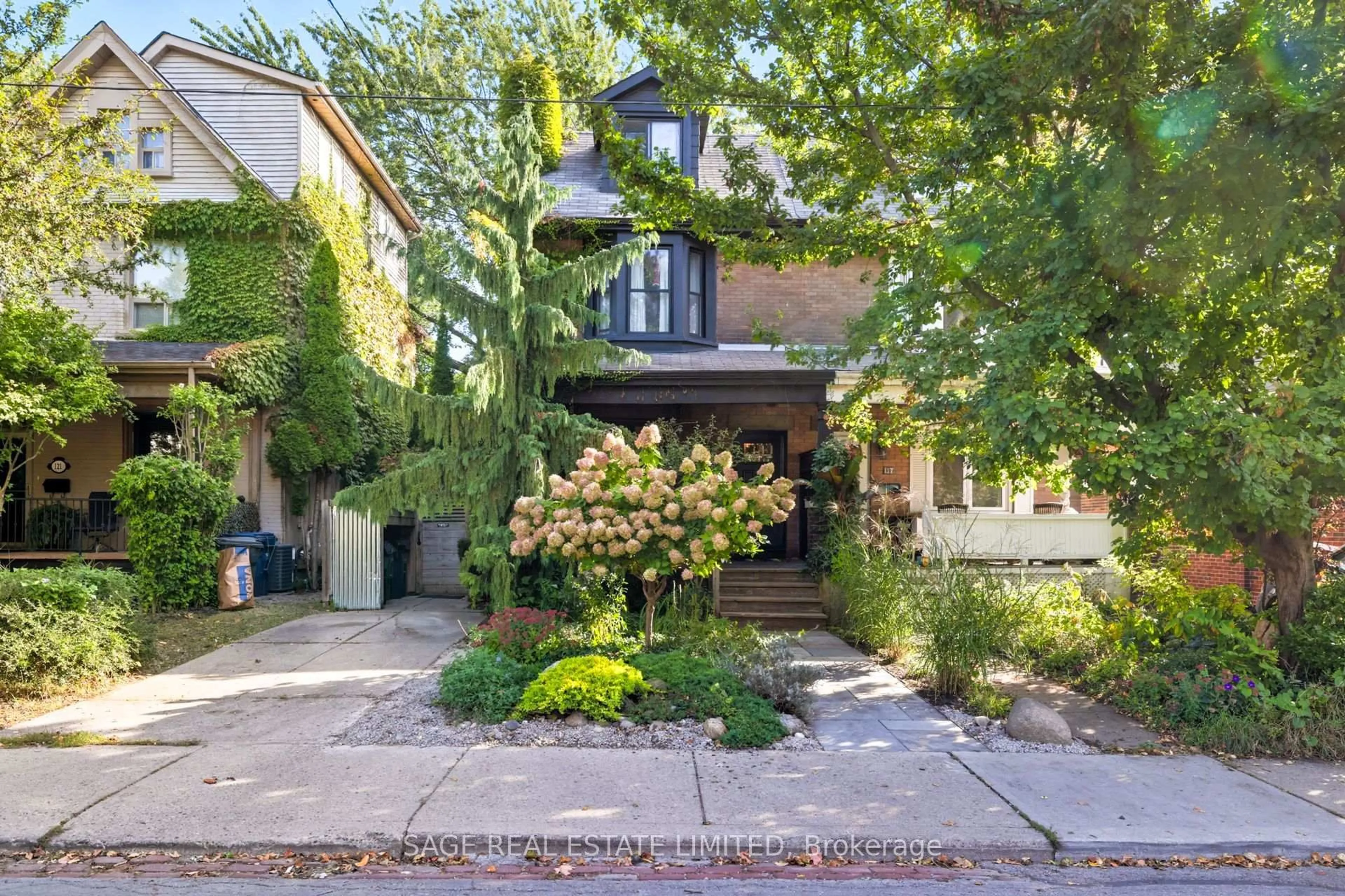 Home with brick exterior material, street for 119 Woodfield Rd, Toronto Ontario M4L 2W5