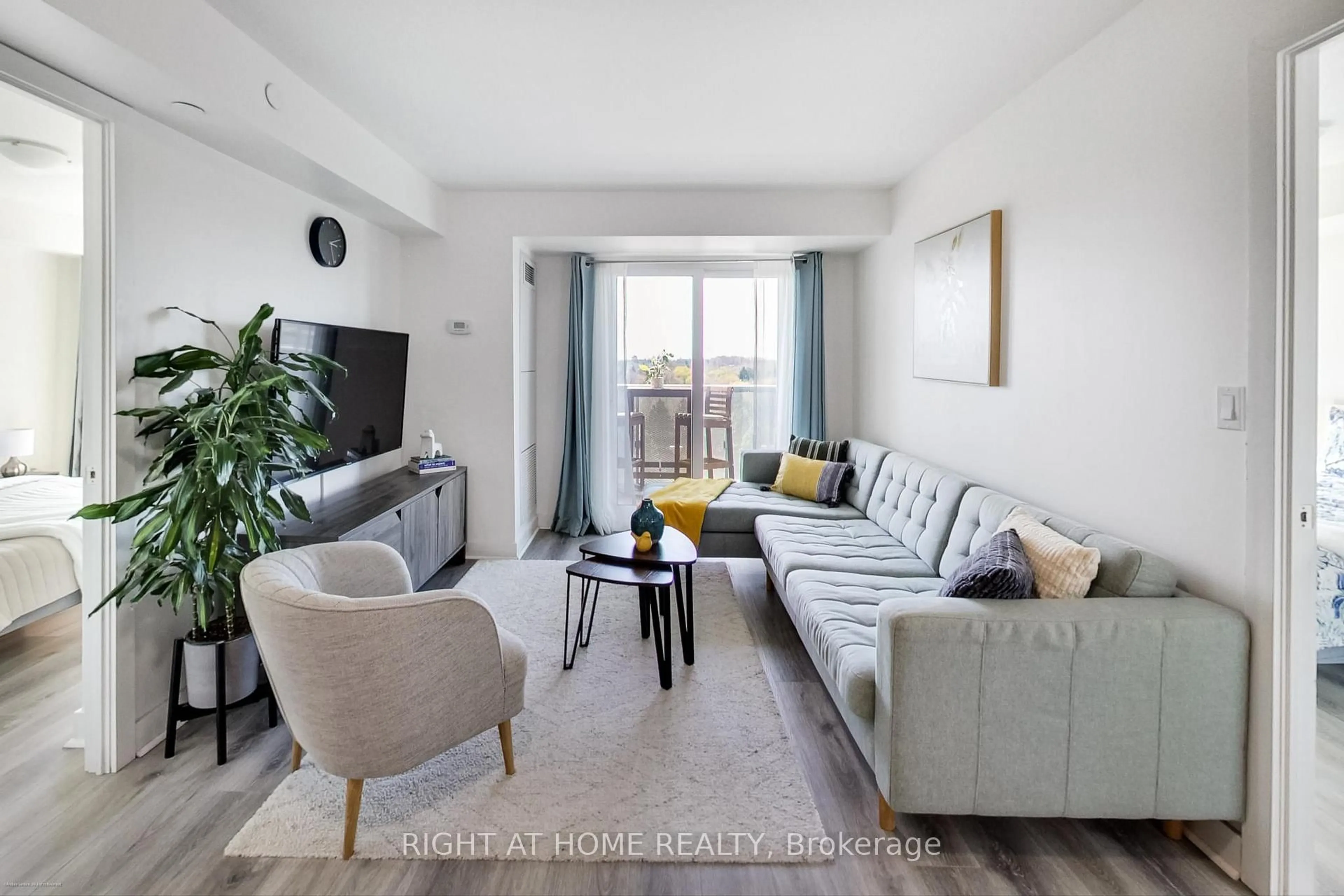 Living room with furniture, unknown for 1346 Danforth Rd #706, Toronto Ontario M1J 0A9