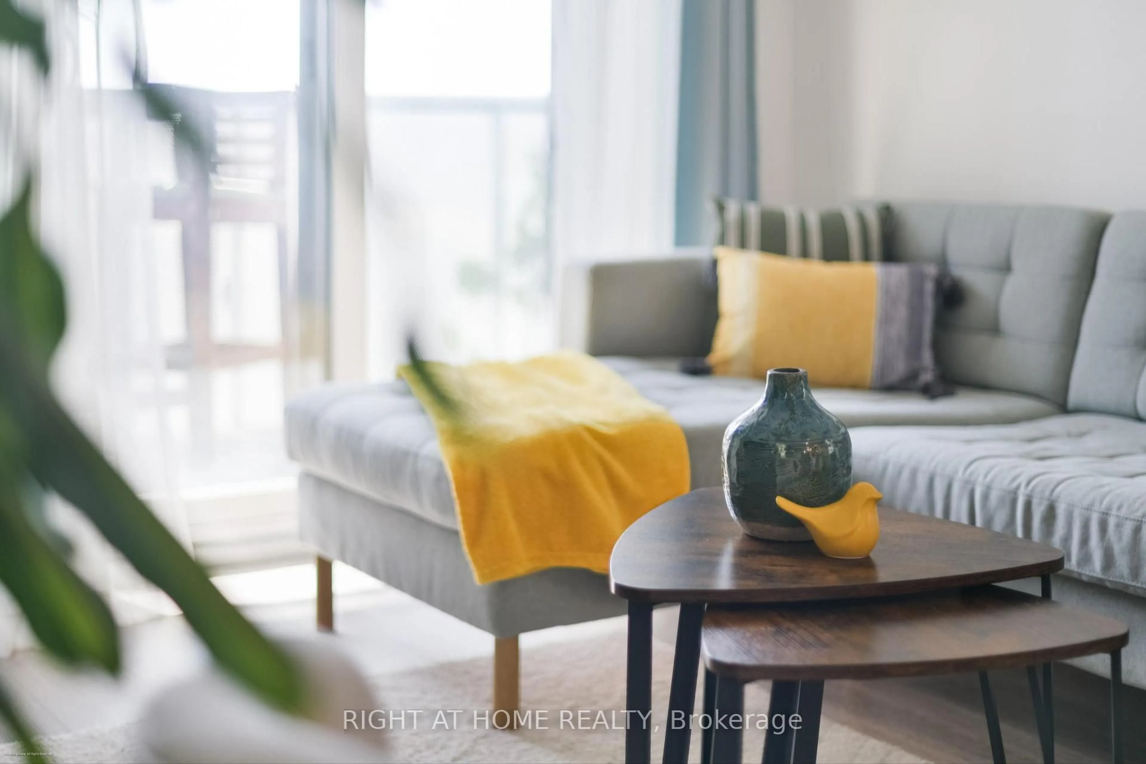 Living room with furniture, wood/laminate floor for 1346 Danforth Rd #706, Toronto Ontario M1J 0A9