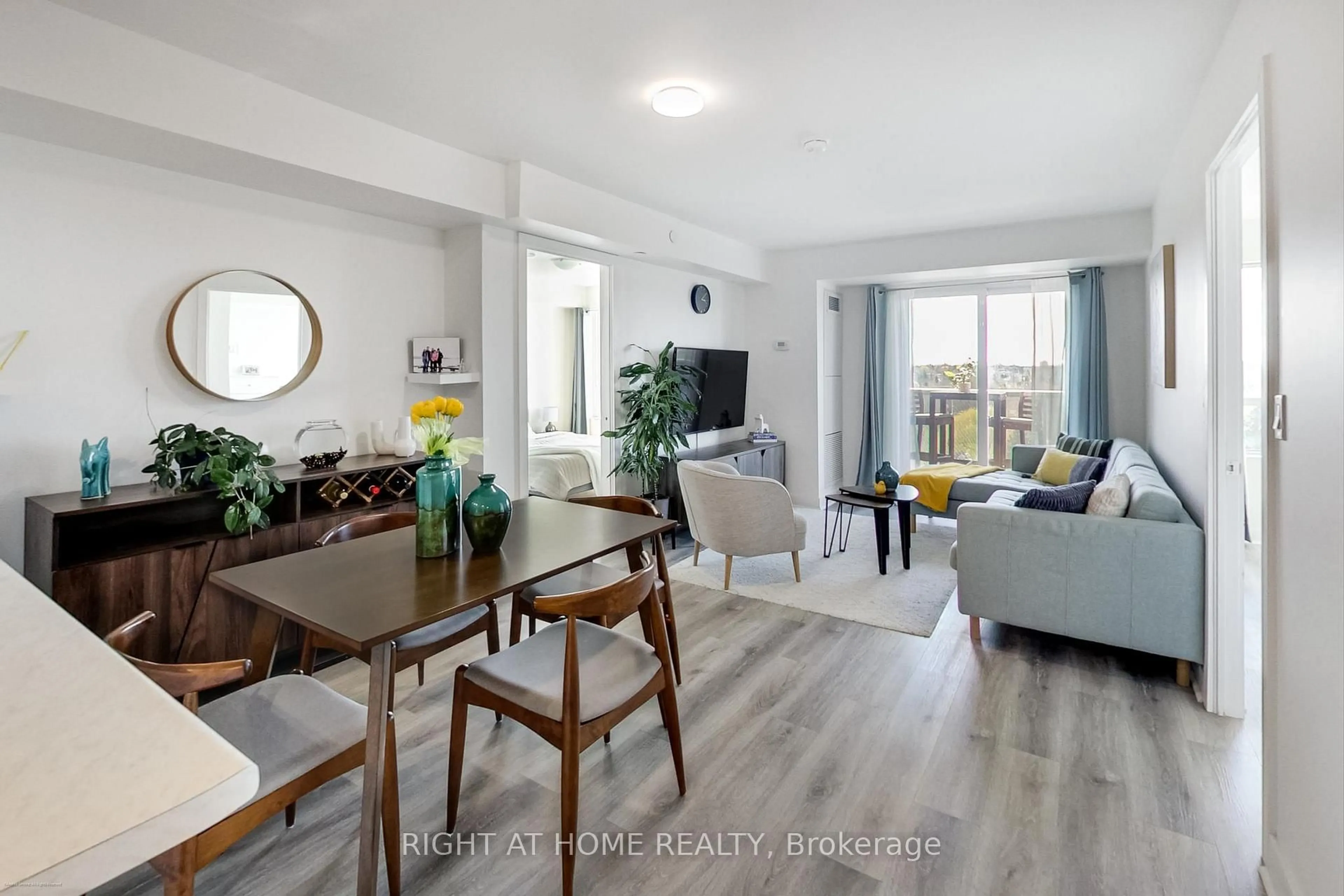 Living room with furniture, wood/laminate floor for 1346 Danforth Rd #706, Toronto Ontario M1J 0A9