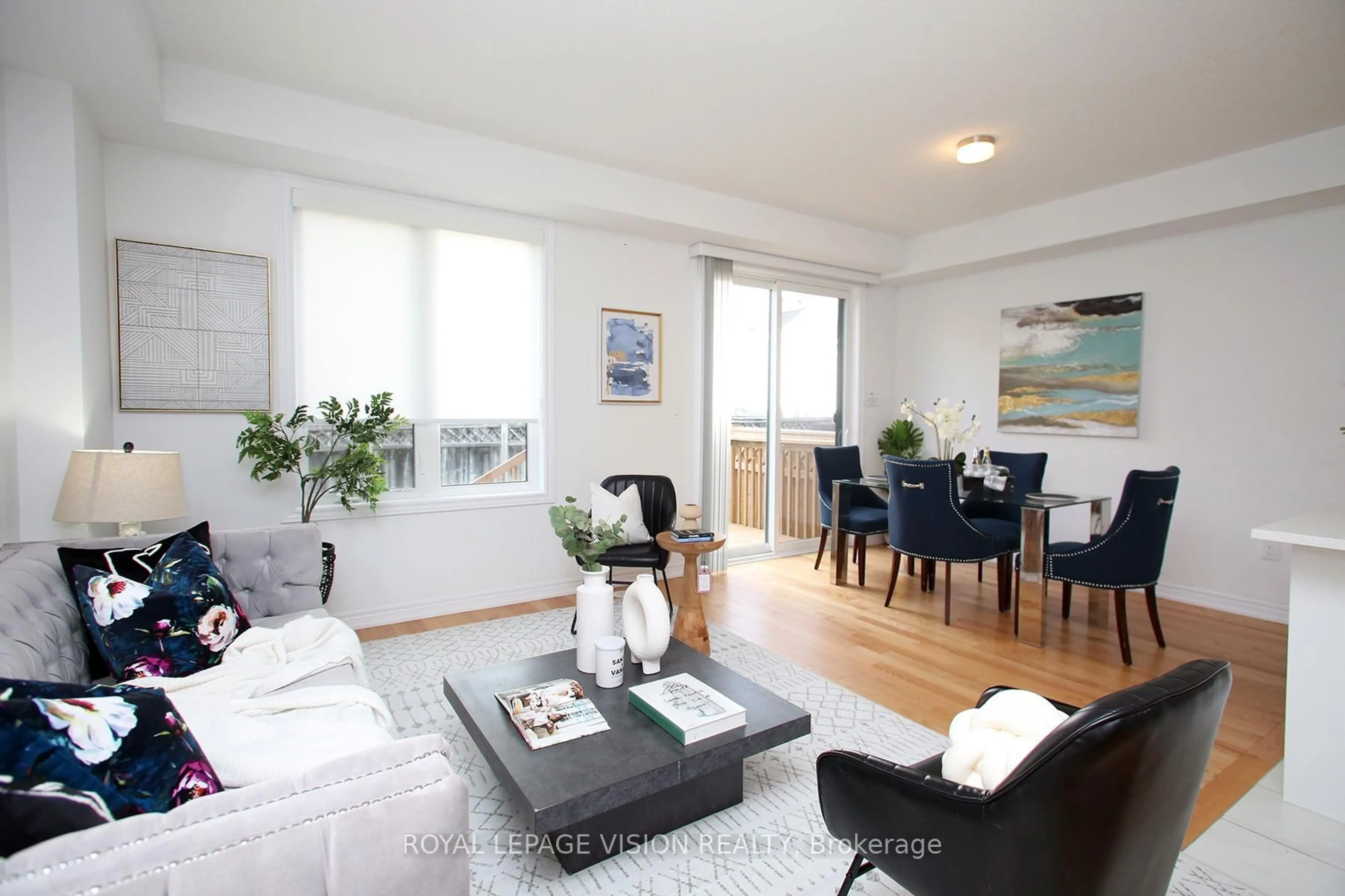 Living room with furniture, wood/laminate floor for 21 Sorbara Way, Whitby Ontario L1M 0M4