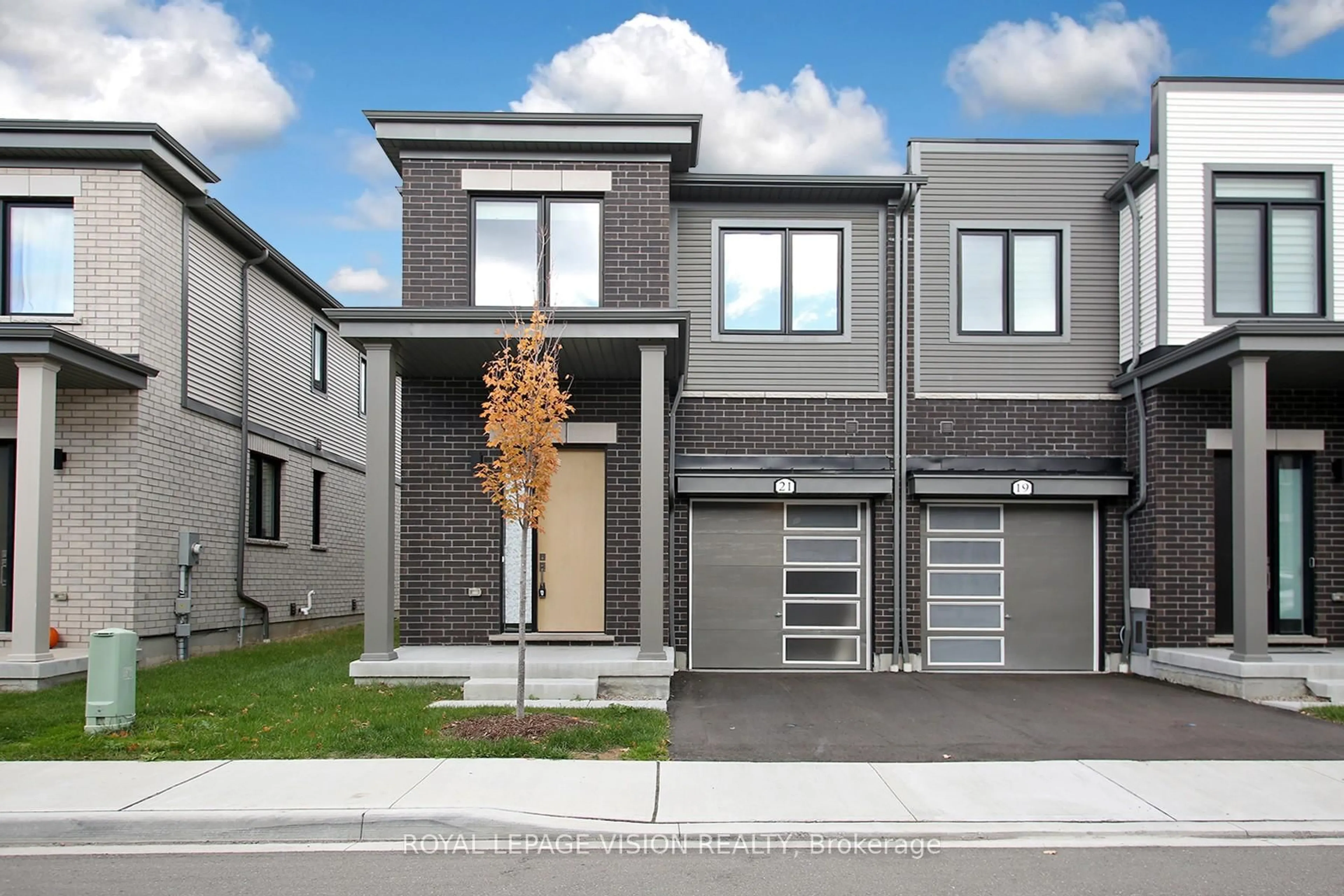 Home with brick exterior material, street for 21 Sorbara Way, Whitby Ontario L1M 0M4