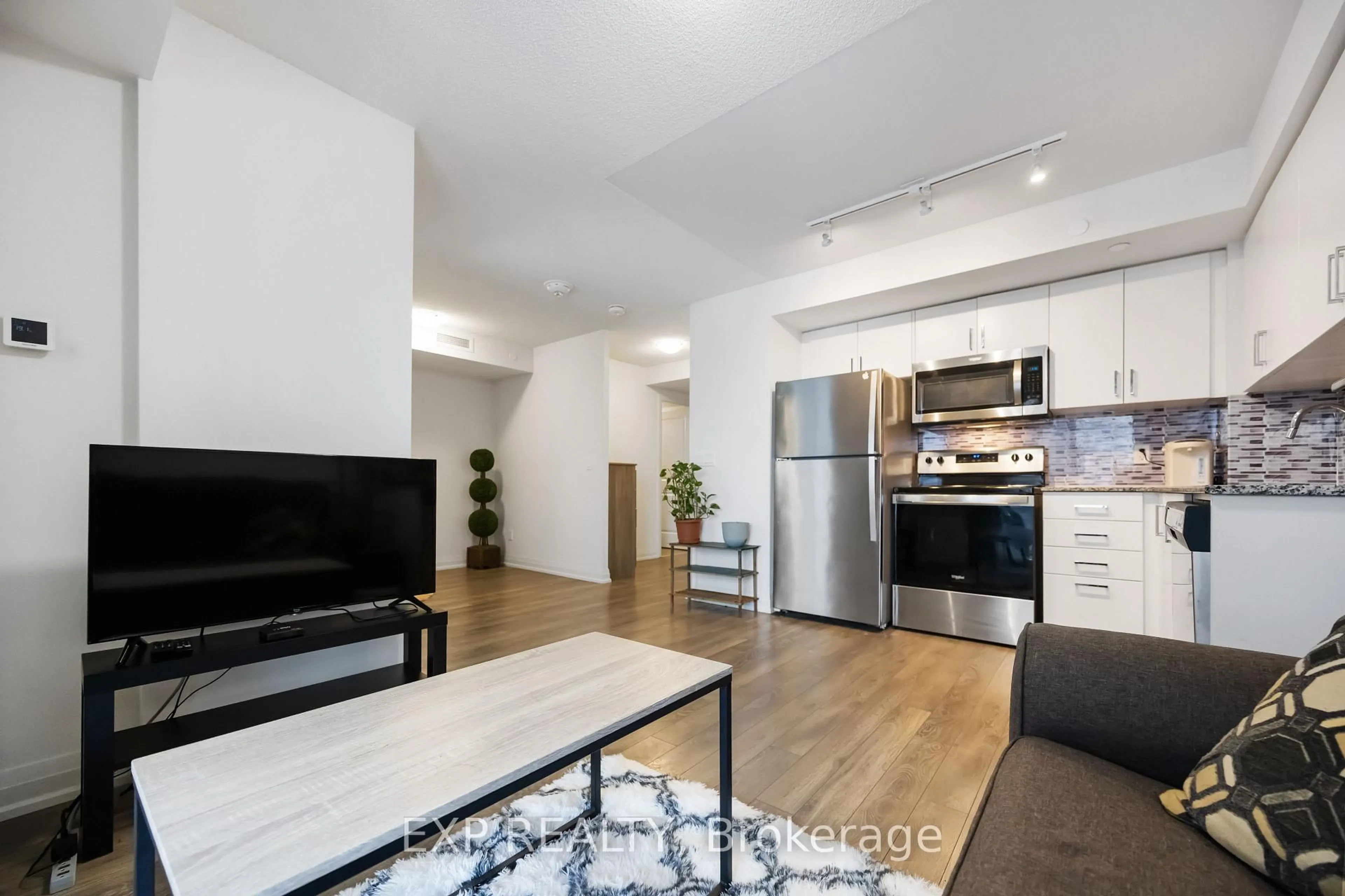 Living room with furniture, unknown for 20 Meadowglen Pl #629, Toronto Ontario M1G 0A9