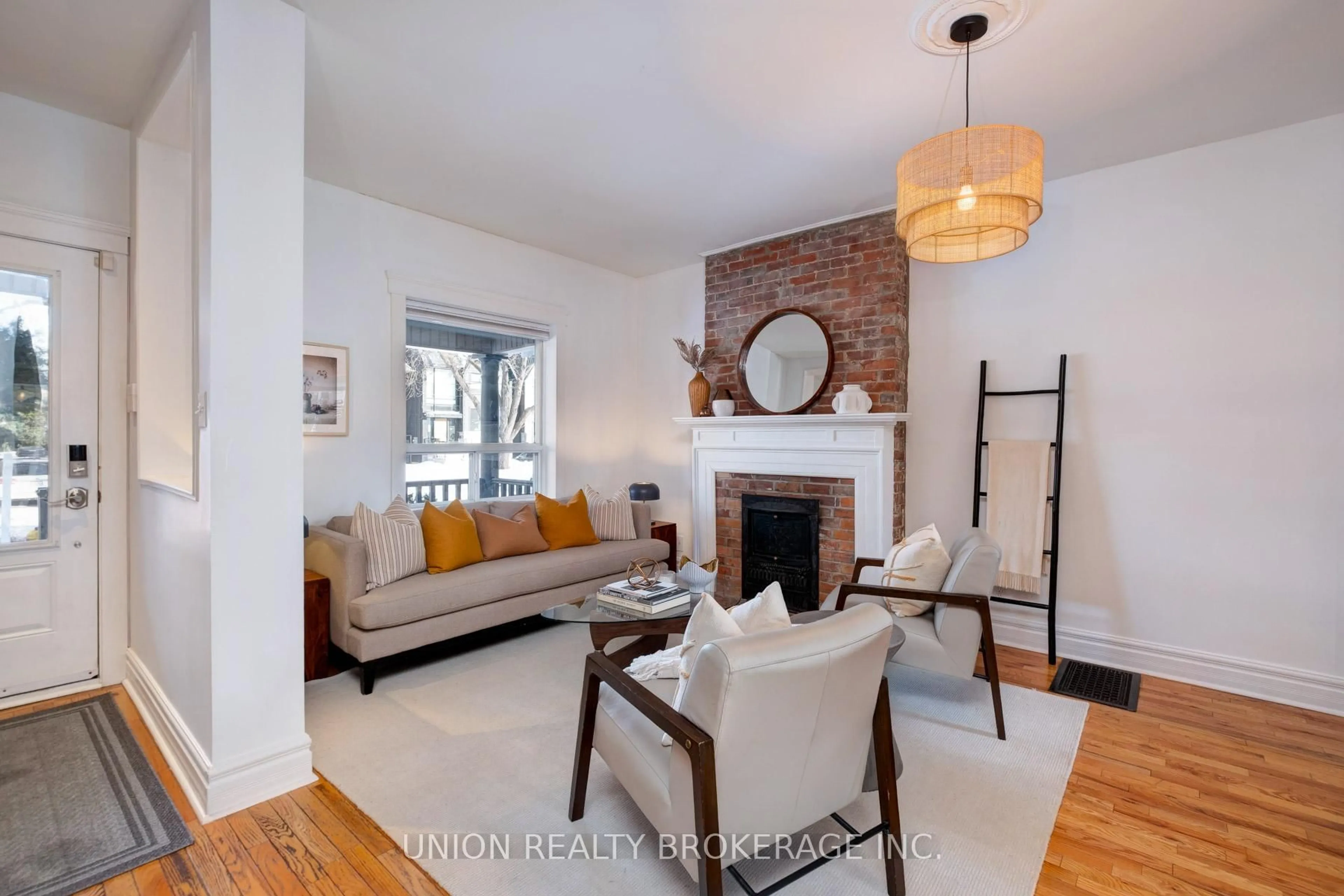 Living room with furniture, wood/laminate floor for 186 Scarborough Rd, Toronto Ontario M4E 3M6