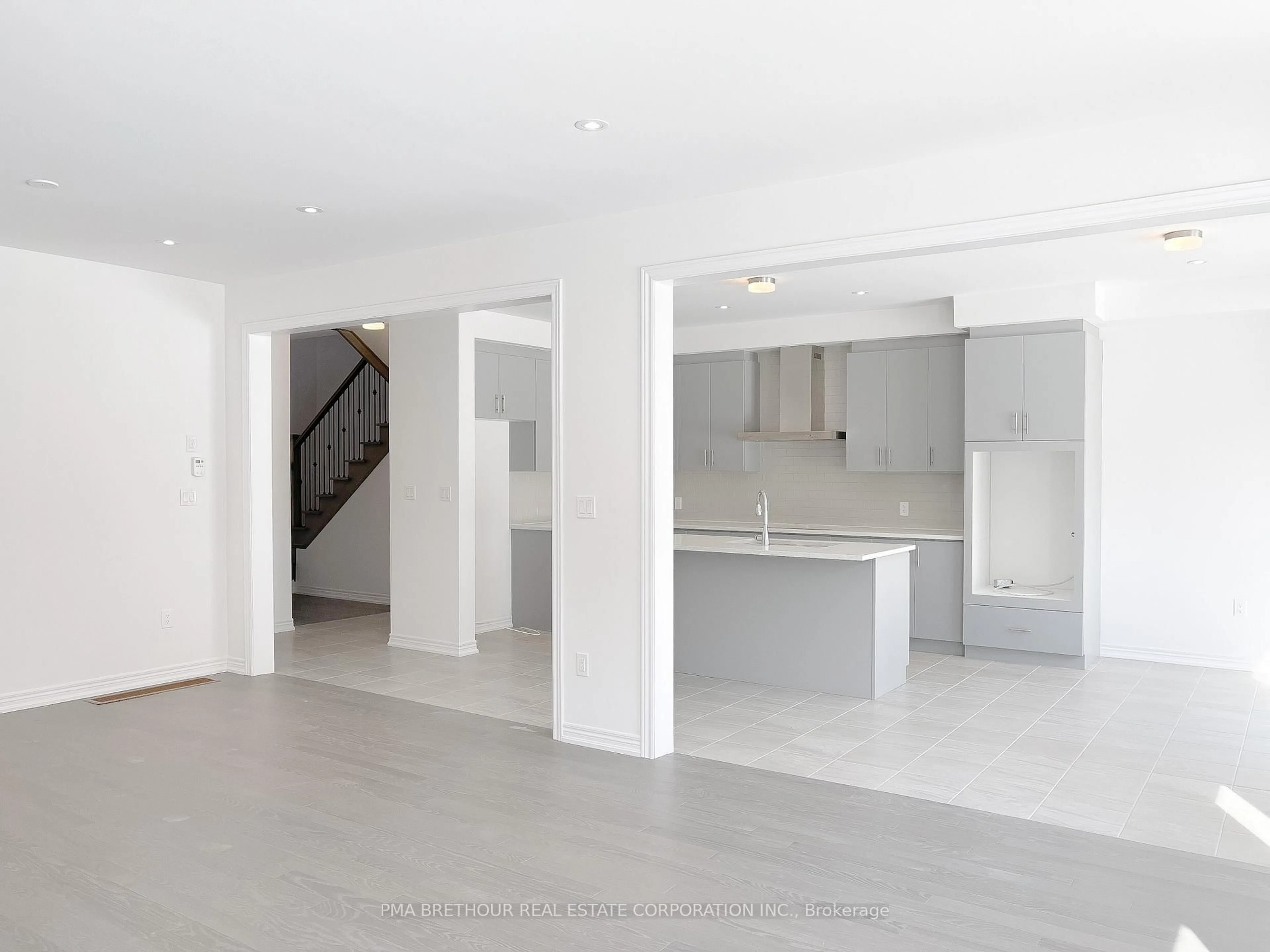 Open concept kitchen, cement floor for 2077 Chris Mason St, Oshawa Ontario L1L 0S5