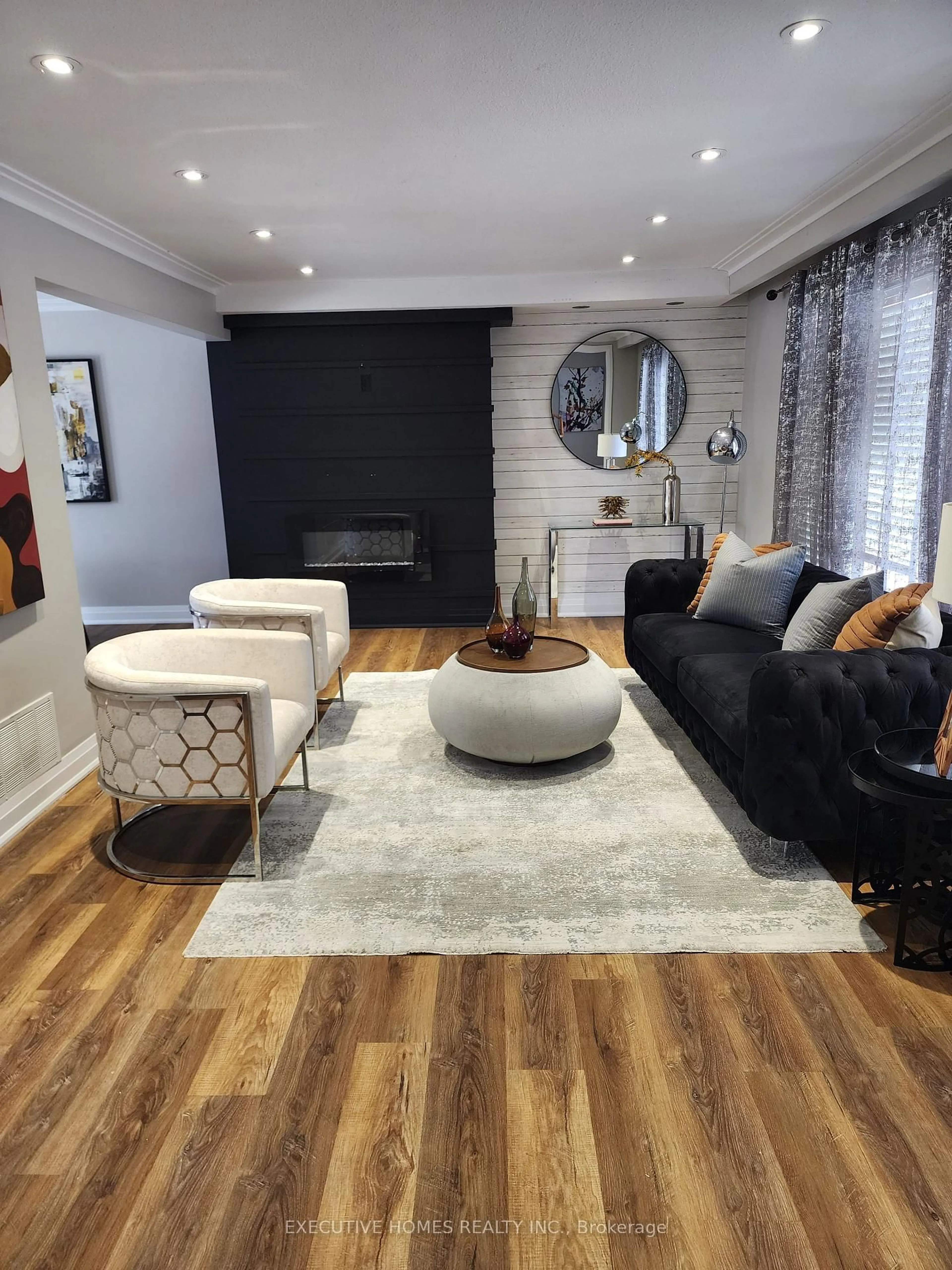 Living room with furniture, wood/laminate floor for 37 Marcella St, Toronto Ontario M1G 1K9