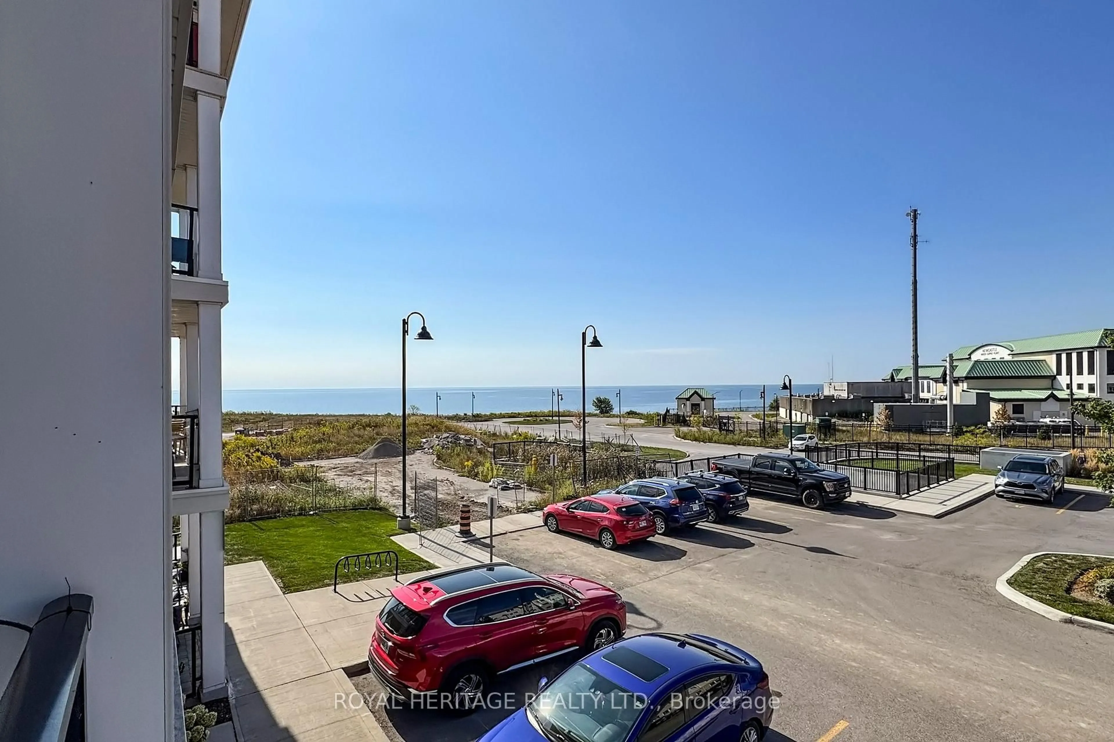 A pic from outside/outdoor area/front of a property/back of a property/a pic from drone, water/lake/river/ocean view for 70 Shipway Ave #214, Clarington Ontario L1B 0V7